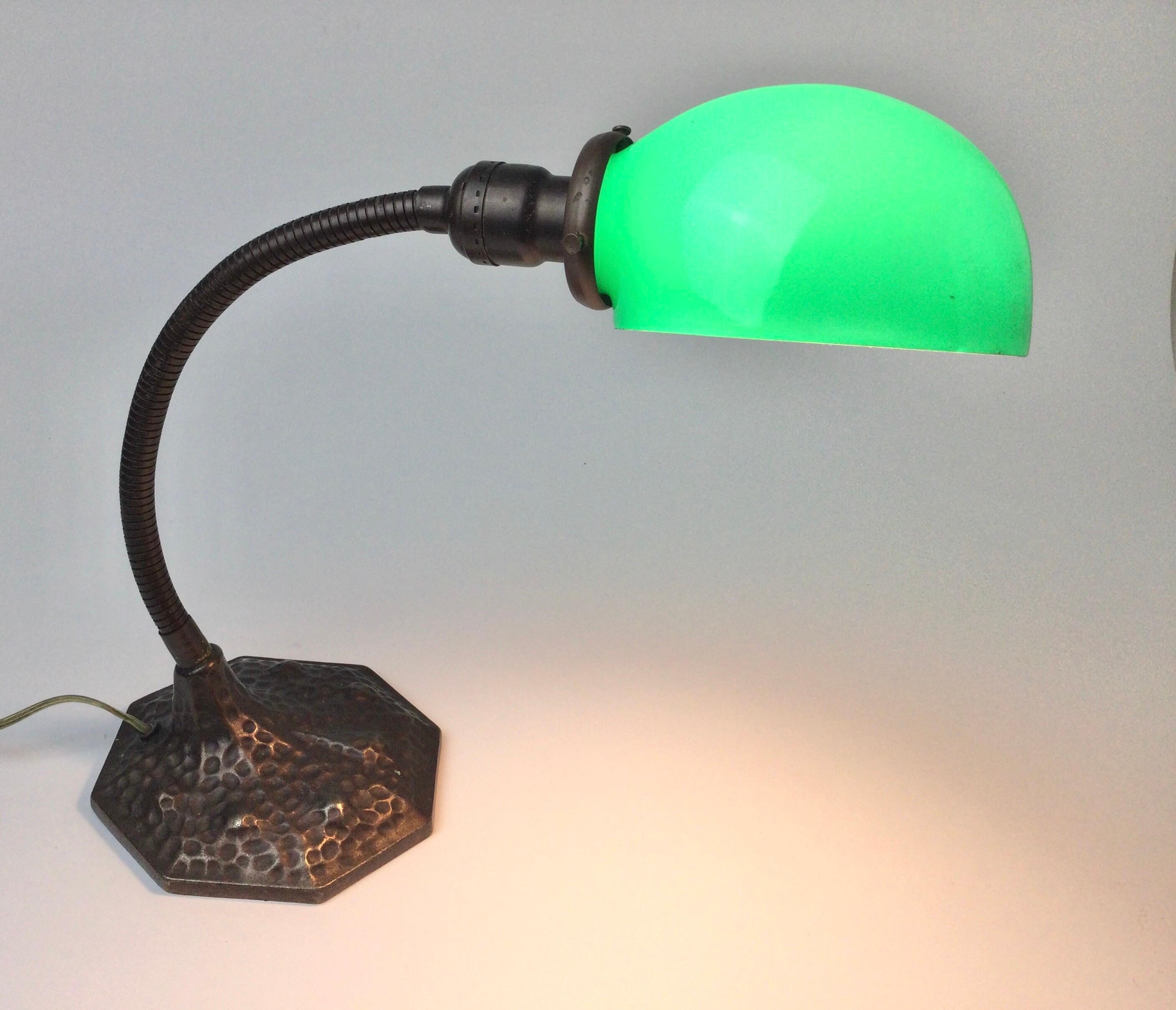 Dark copper patina on case iron base with bendable adjustable arm. Partial Prince Lamp Co tag. Original glass shade is marked Elite Glass. Recently rewired. Approximate measurements of how shown 13 1/2