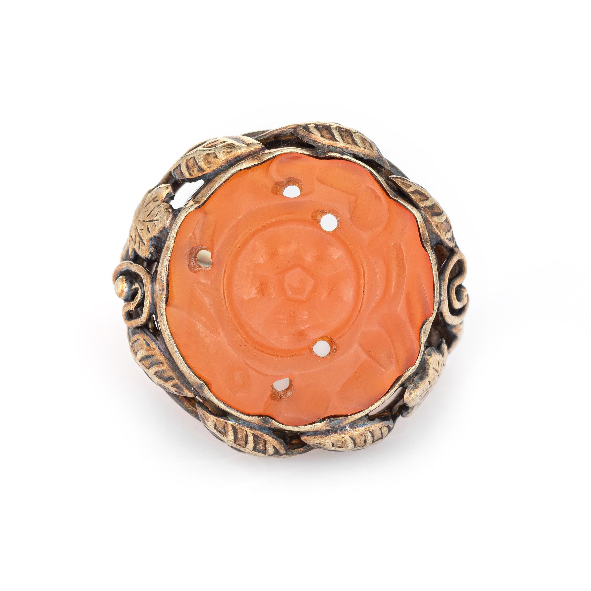 Finely detailed antique Arts & Crafts movement carved carnelian ring (circa 1910s) crafted in 14 karat white gold. 

Carved carnelian measures 14mm diameter. The stone is in very good condition and free of cracks or chips. 

The Arts & Crafts