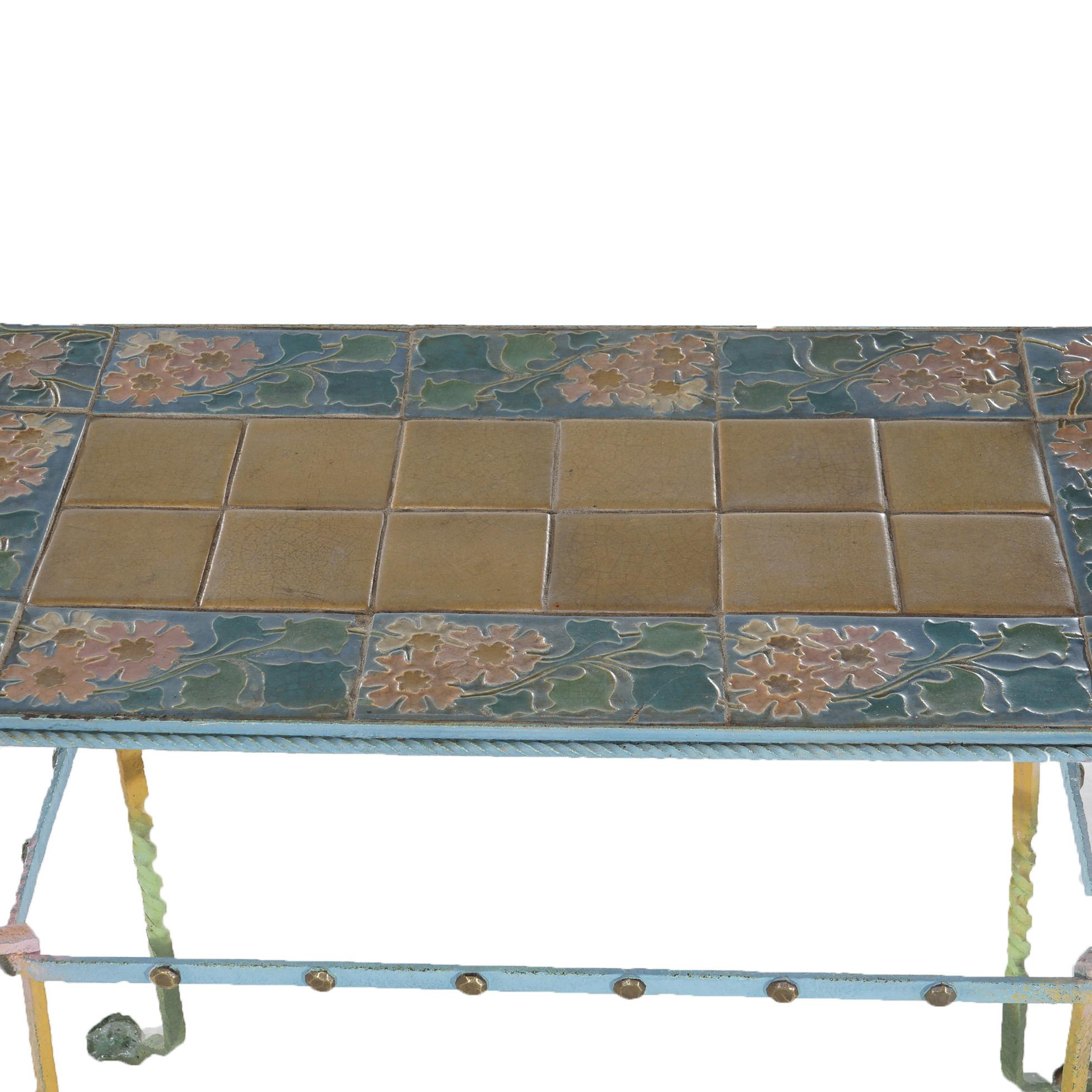 Antique Arts & Crafts Table with Floral Rookwood or Grueby Pottery Tile Top over Wrought Iron Base with Twisted Legs Having Foliate Elements and Stylized paw Feet, C1910

Measures- 31.5''H x 35''W x 20''D