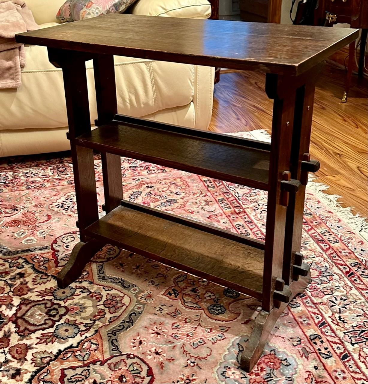 Arts & Crafts Roycroft Little Journey Oak Book Stand circa 1910

Roycroft’s Little Journeys table is constructed with keyed mortise and tenon on three shelves. It is signed with the original metal tag. Overall good condition, tight and sturdy with