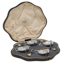 Arts & Crafts set of sterling silver salt cellars and spoons made in London 1904