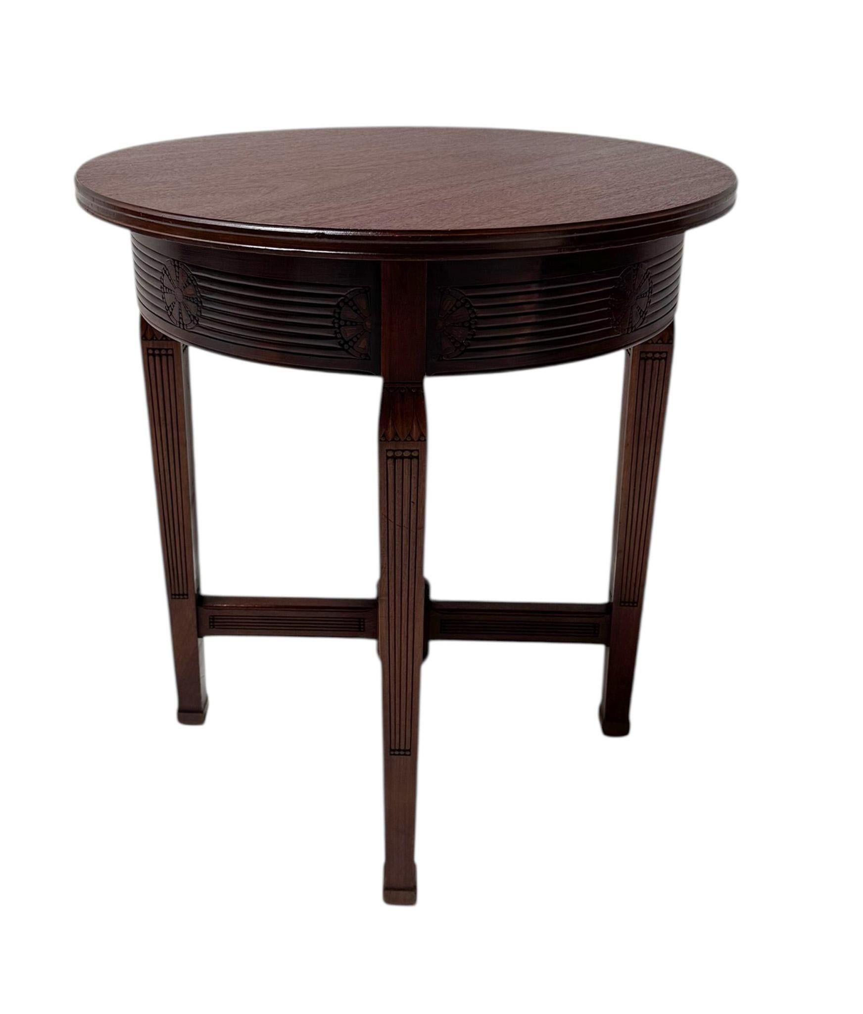 Magnificent and ultra rare Arts & Crafts side table.
Design by Johann Georg van Caspel for H.F. Jansen & Zonen Amsterdam.
Striking Dutch design from the 1900s.
Solid hand-carved walnut base with original solid walnut top.
Stamped with manufacturers