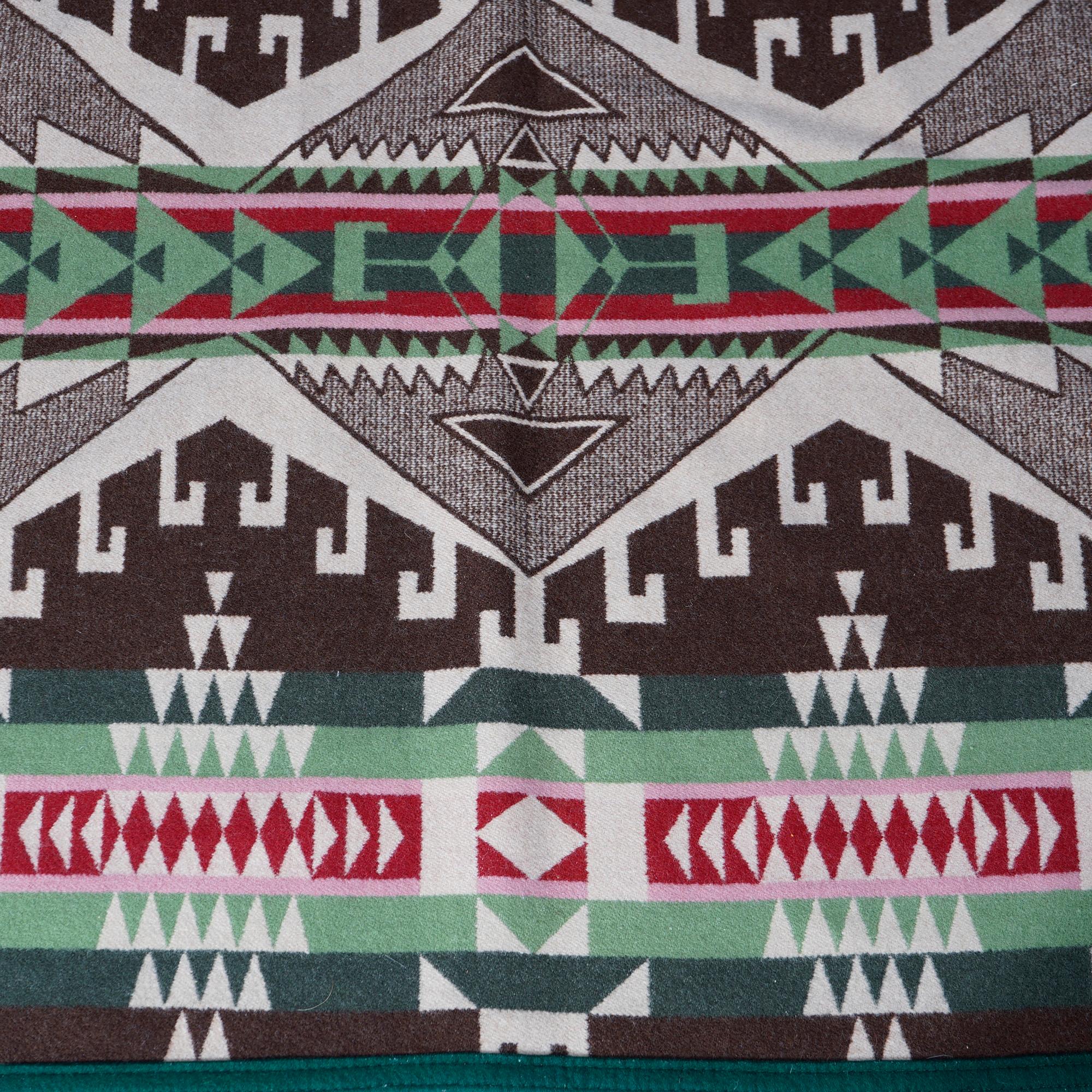 An Arts & Crafts style blanket by Pendleton Woolen Mills of the Heritage Collection offers wool construction with Southwestern American Indian design, maker label as photographed, 20th century

Measures- .5''H x 81.25''W x 63.25''D.