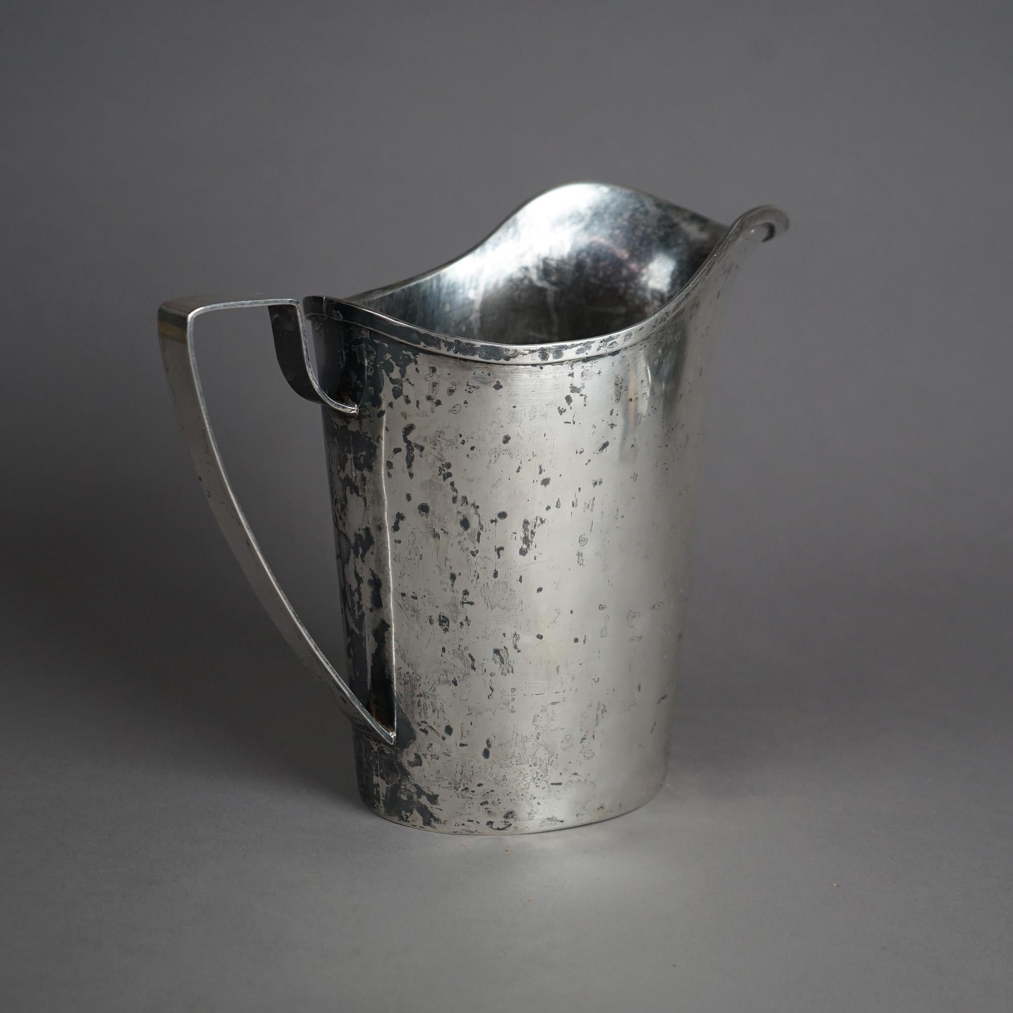 Antique Arts & Crafts Sterling Silver Hand Wrought Pitcher, Monogram AS, Possible Arthur Stone, 32.66 OTZ; marked Almagam

Measures- 9.25''H x 5.25''W x 10.5''D