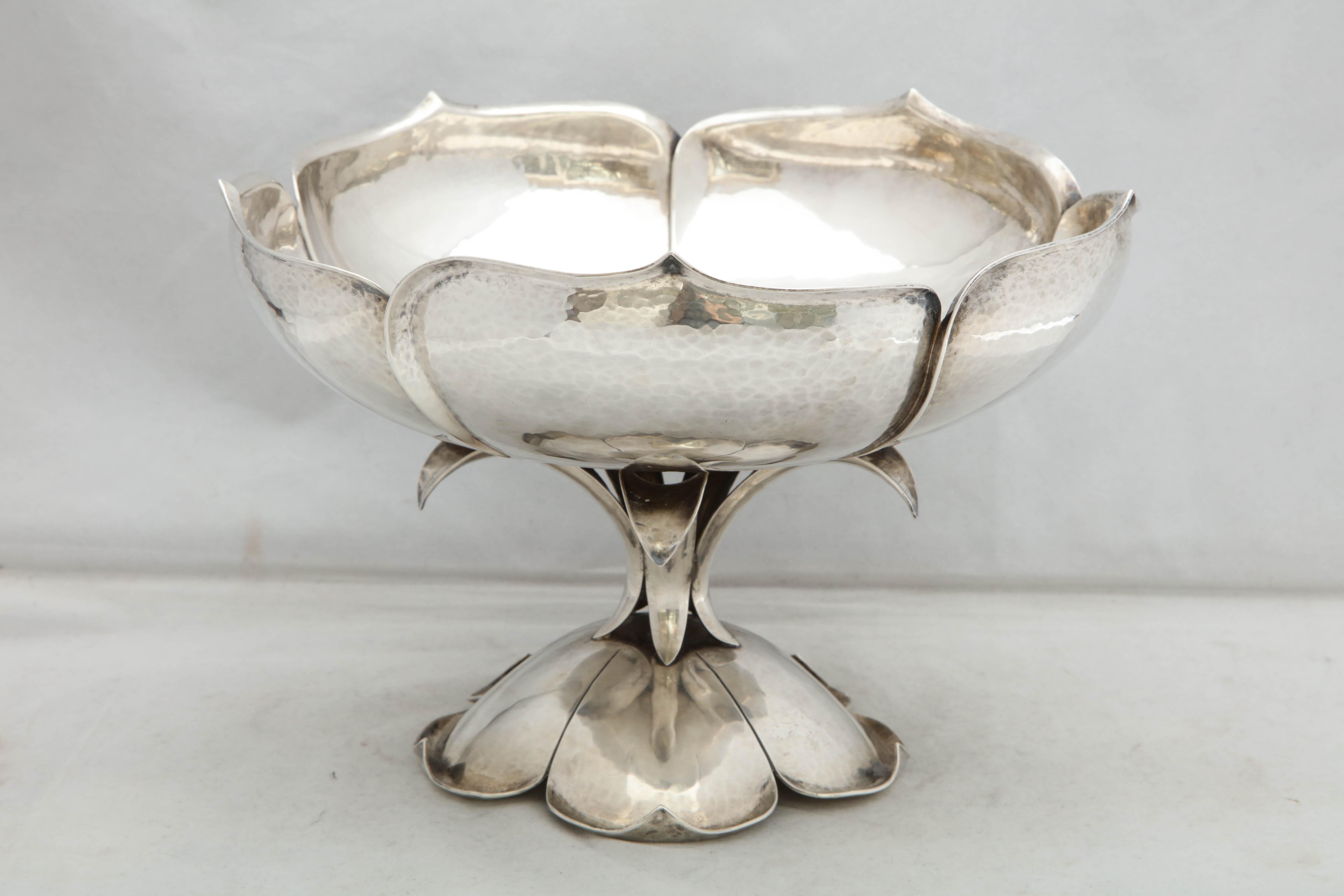 Arts & Crafts, graceful, sterling silver, lotus - form centerpiece bowl by Cellini (The Cellini Shop), Evanston, Illinois, circa 1930. Lightly hammered design. Measures 7 3/4 inches high x 9 5/8 diameter. Weighs 39.130 troy ounces. Excellent
