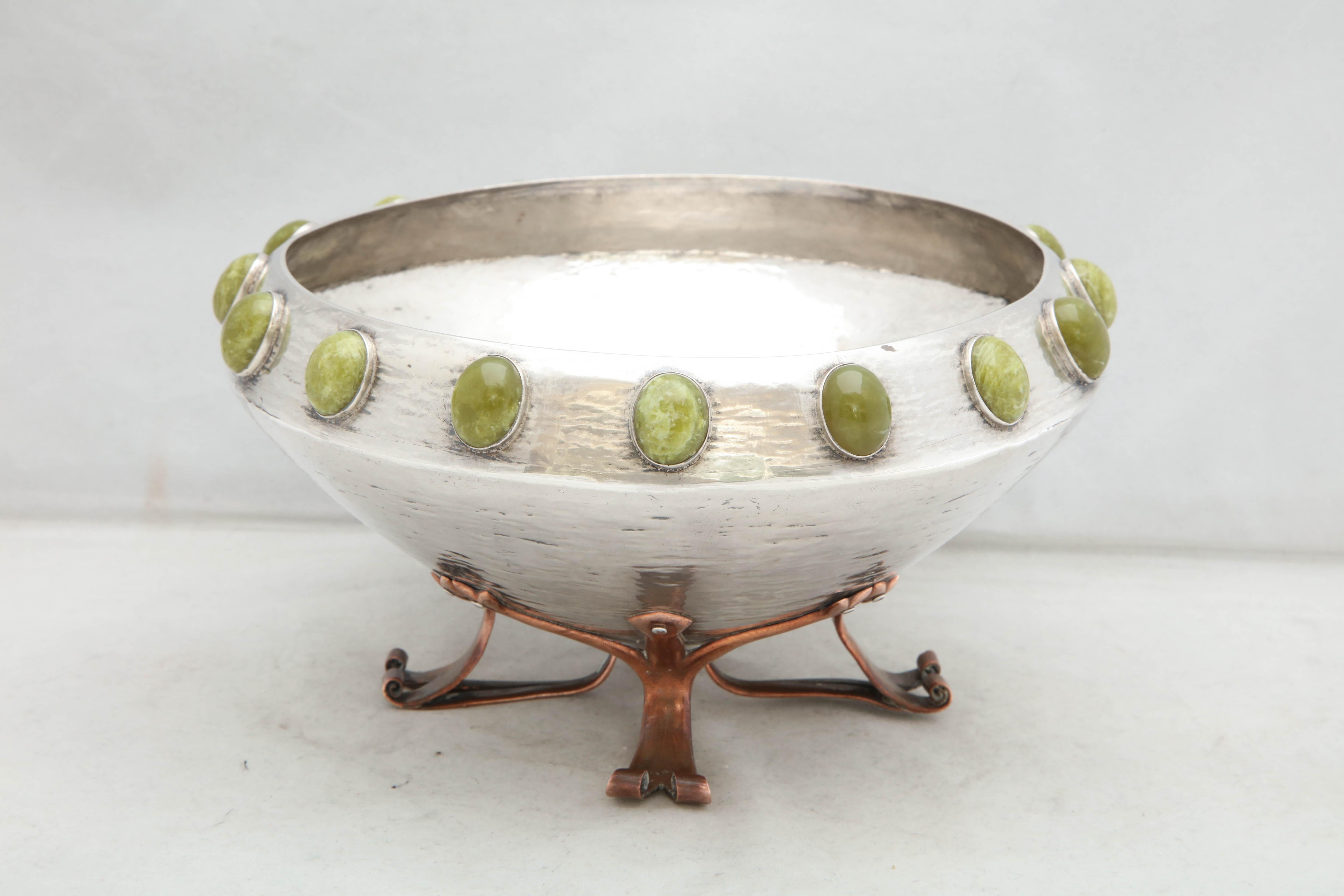 Arts & Crafts, sterling silver, mixed metals and hardstone bowl with copper, scrolled, footed base, Birmingham, England, 1898, William Hair Haseler - maker. Rim of sterling silver bowl is mounted with cabochon hardstones; footed base is made of