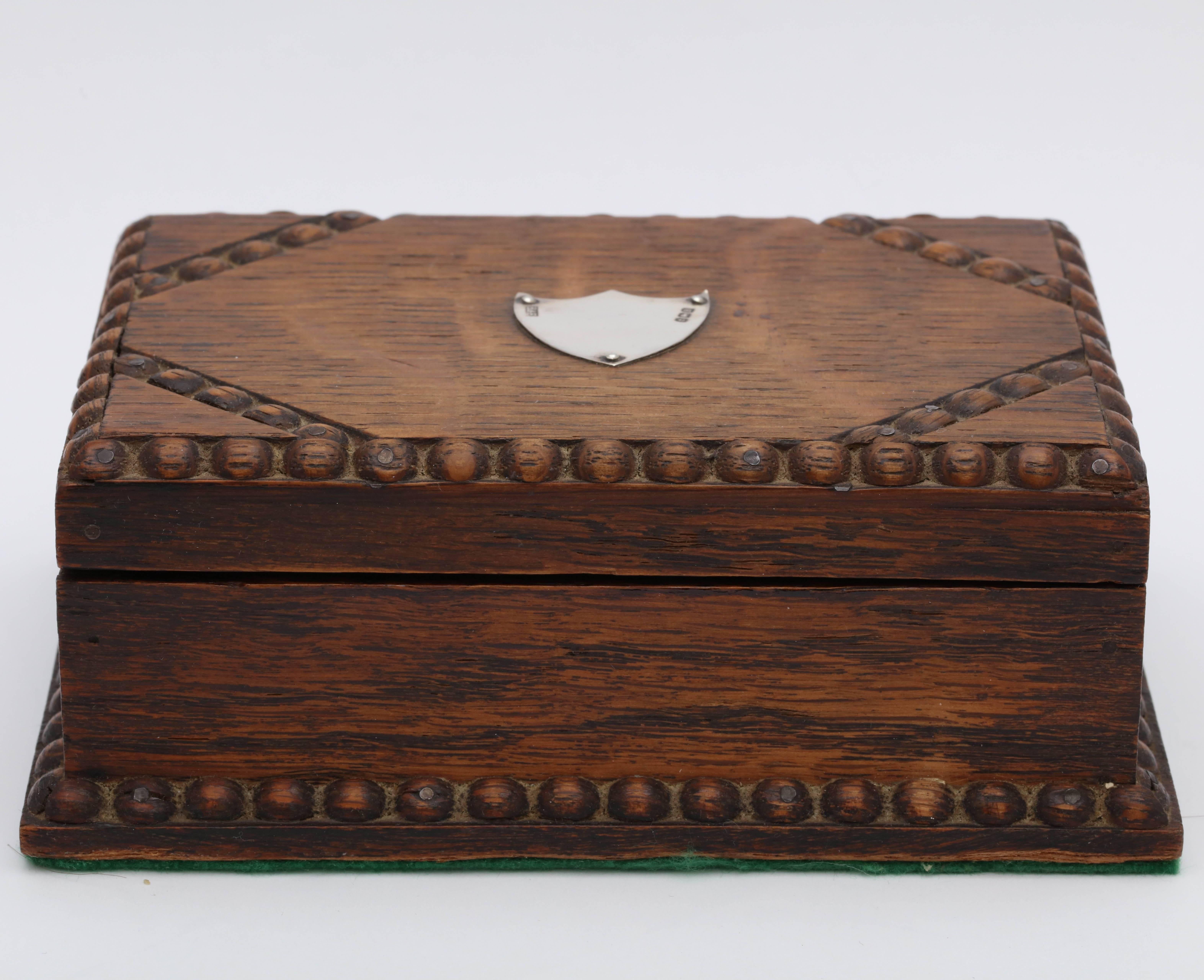 Arts & Crafts, sterling silver - mounted oak table box with hinged lid, Birmingham, England, 1926, William Sydney Hall and Edward Thurston Davies (trading as Hall and Fitzgerald) - makers. Measures 5 1/2 inches wide x 4 inches deep x 2 1/4 inches