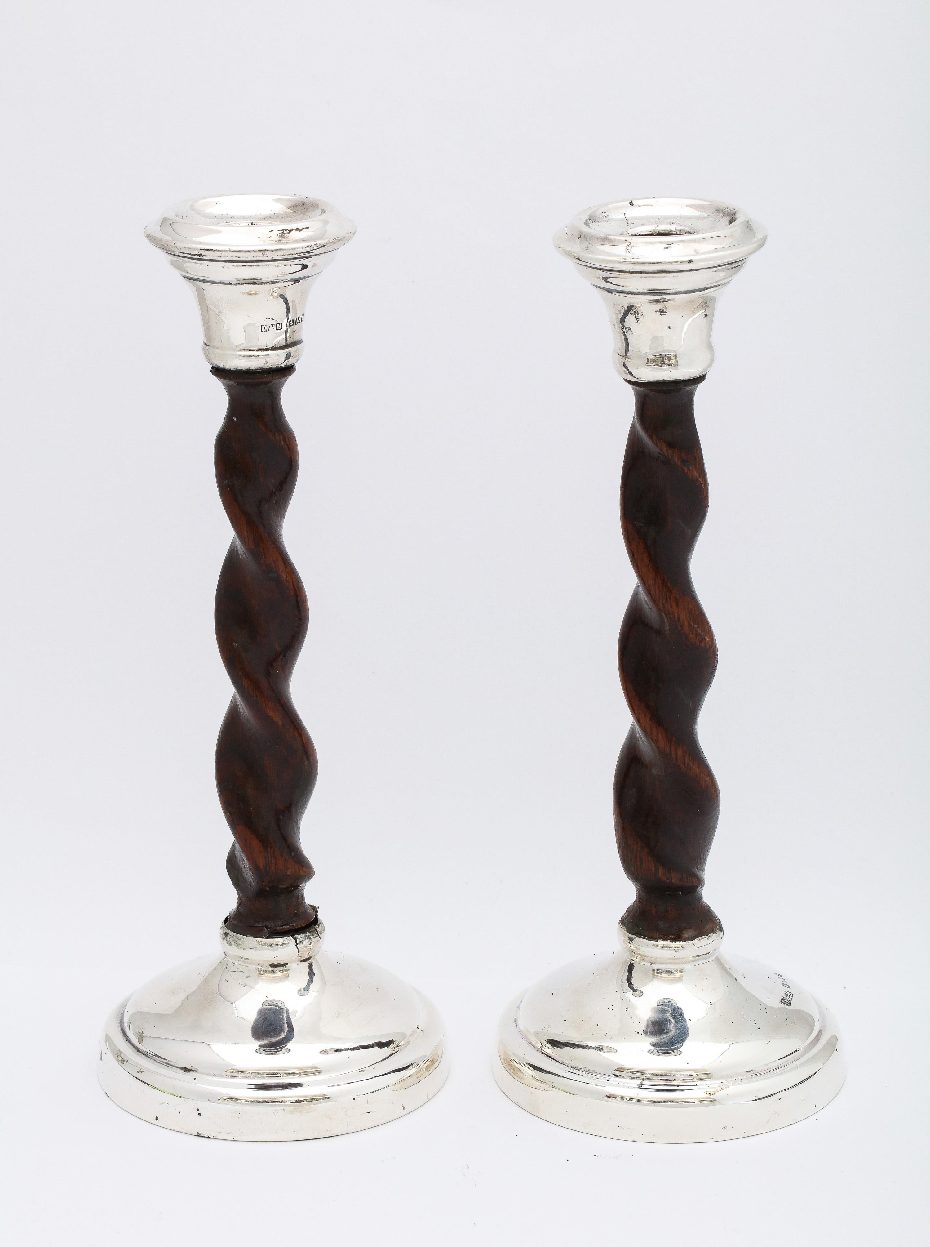 Arts and Crafts Period, sterling silver-mounted barley twist wood pricket candlesticks, Birmingham, England, year-hallmarked for 1930, Deykin and Harrison - makers. Each candlestick measures 8 3/4 inches high (at highest point - without pricket) x 3