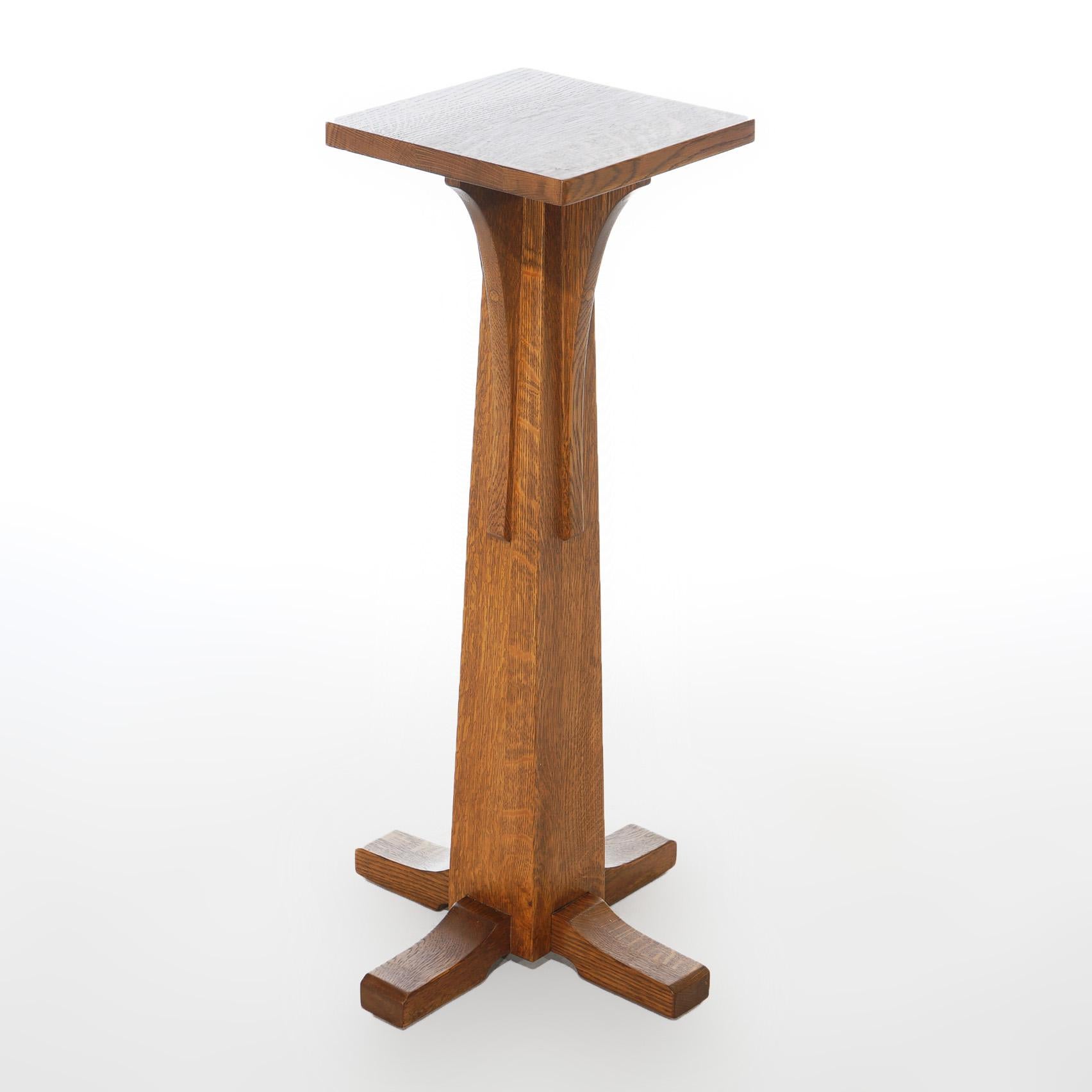 An Arts and Crafts Mission plant stand pedestal by Stickley offers oak construction with square display over flared and footed base, maker stamp as photographed, 20th century

Measures- 36.5''H x 18''W x 18''D