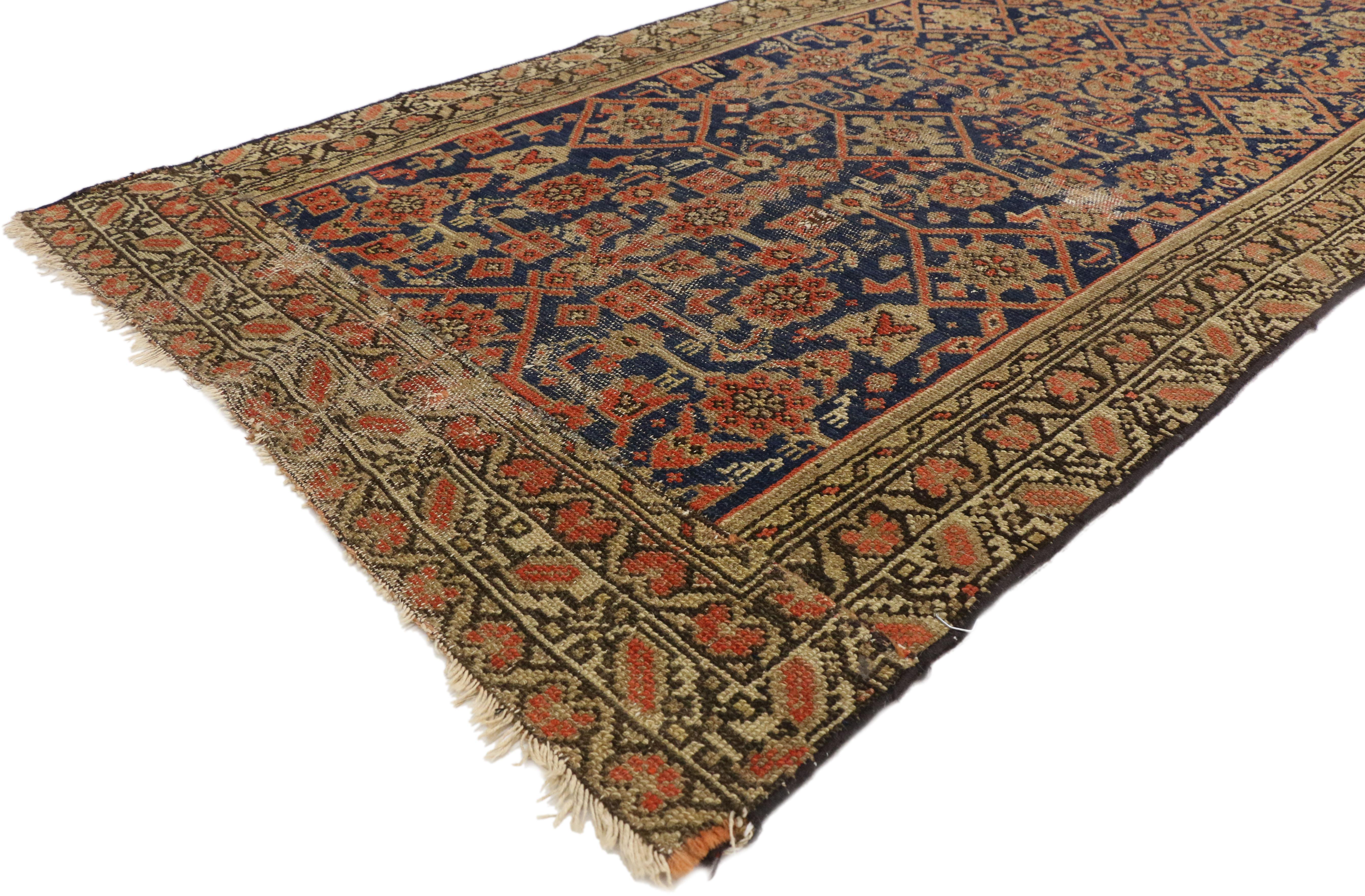 74454 Distressed Antique Persian Malayer Runner with Rustic Arts & Crafts Style, Hallway Runner 03'00 x 09'04. This hand knotted wool distressed antique Persian Malayer runner features a dynamic all-over Herati pattern dotted with animal motifs