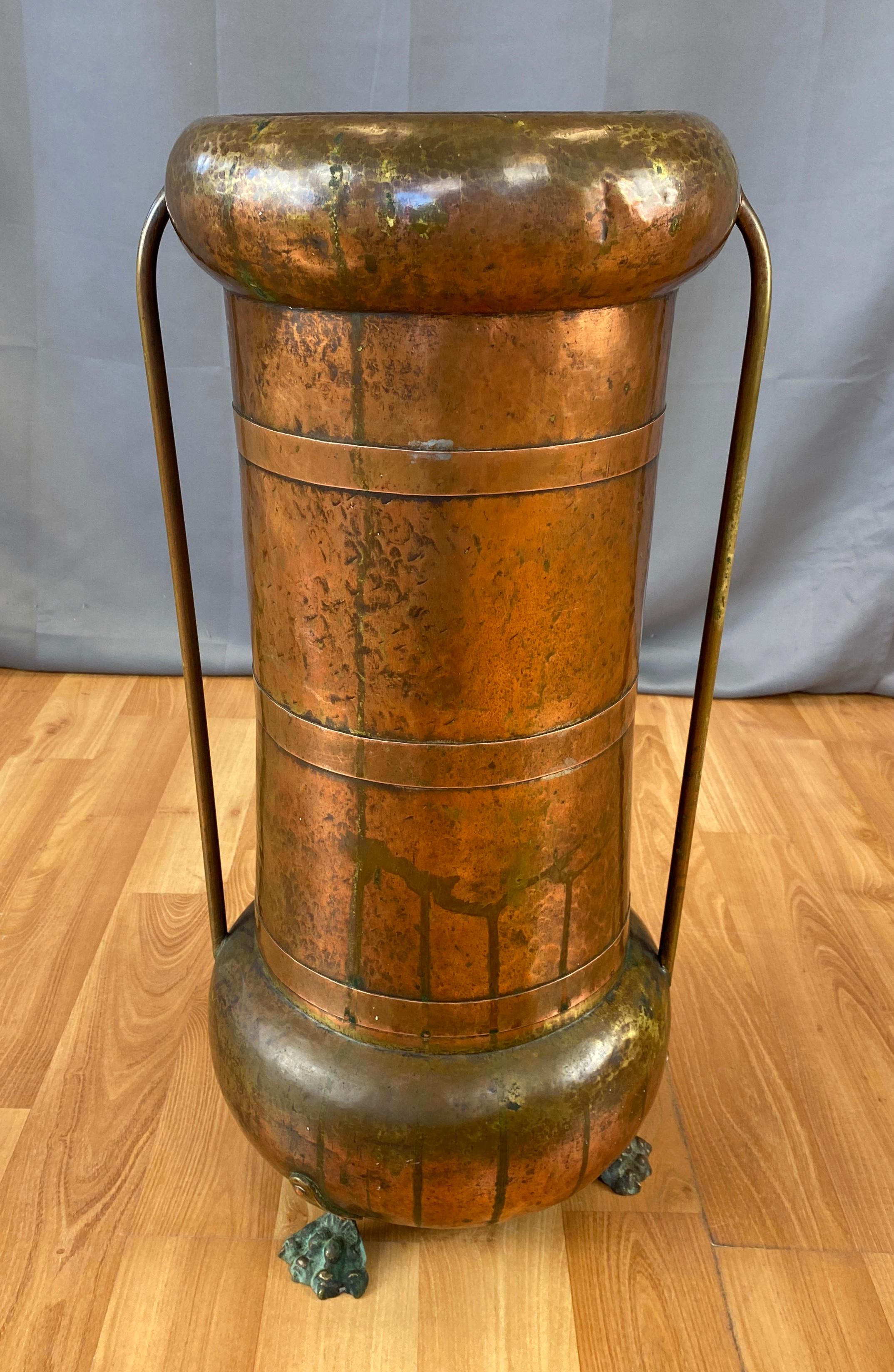 Offered here is a Arts & Crafts style hammered copper footed umbrella or cane stand that's Russian, has a Imperial Double Headed Eagle stamped on it's under side (14 photo). 
Wonderful finish, and patina that can only come with age.