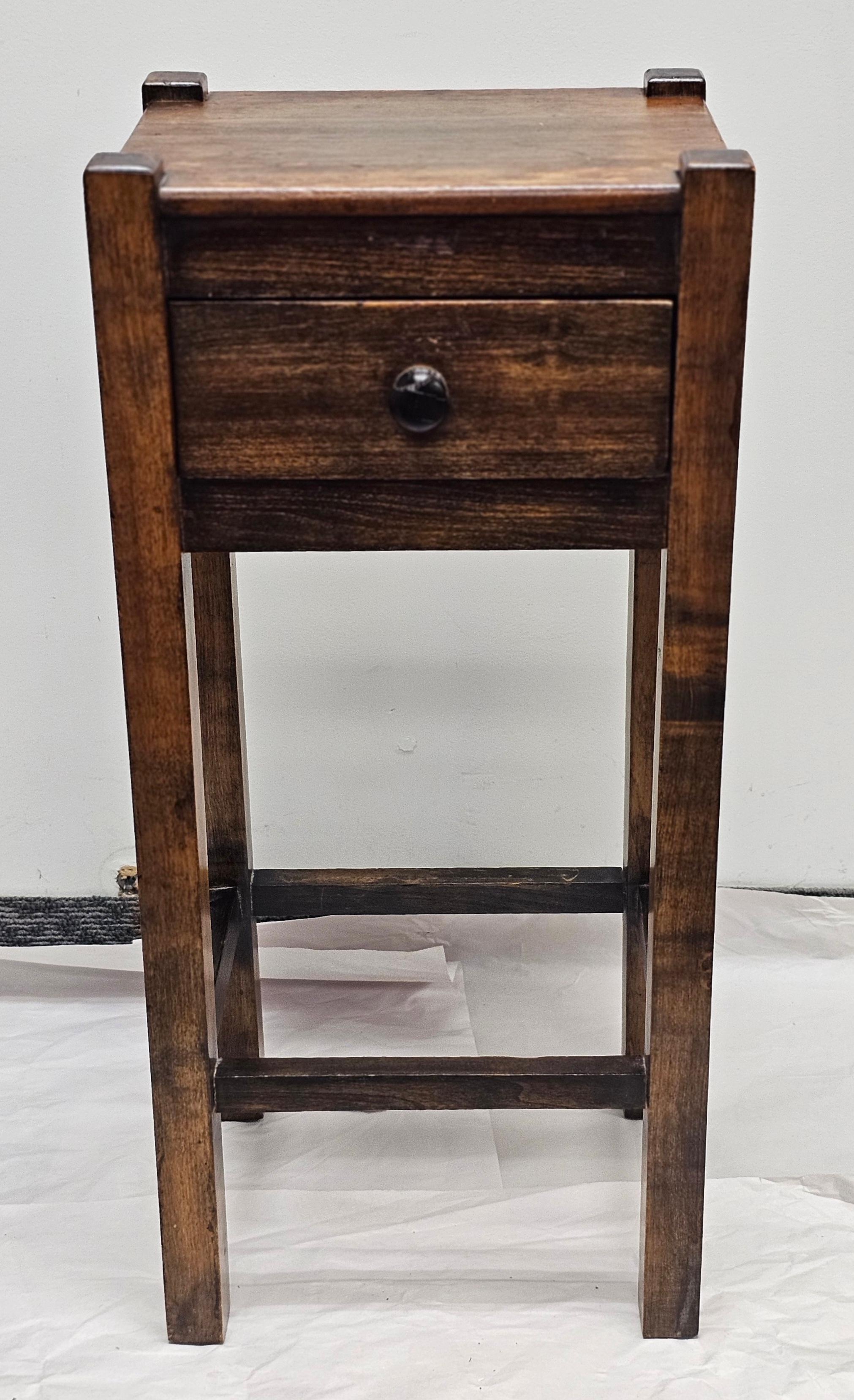An Arts & Crafts Style Stained Fruitwood Narrow Single Srawer Work Table
Measures 13