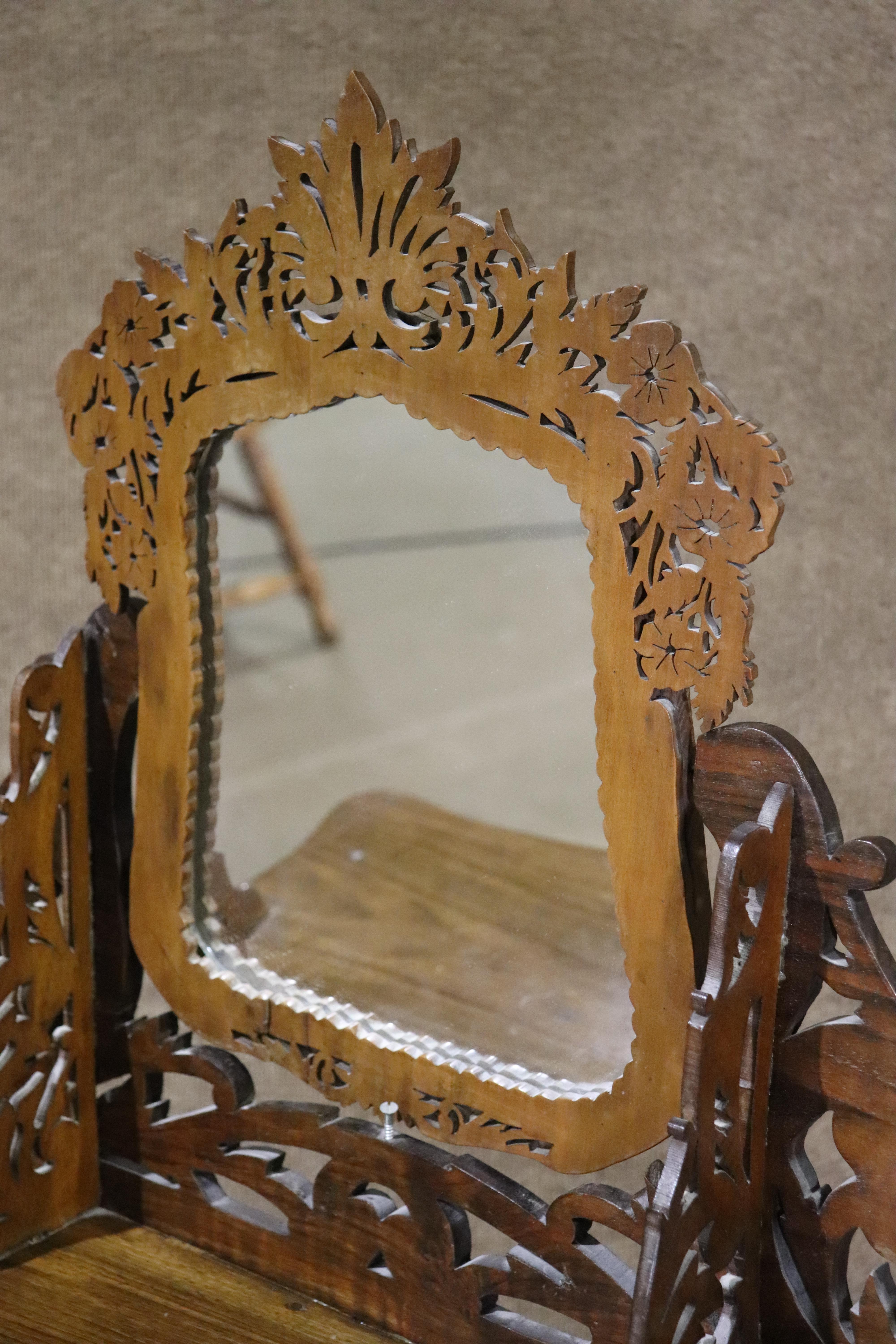 This small wood vanity features carved wood throughout. Intricate cut out designs with single drawer.
Please confirm location NY or NJ