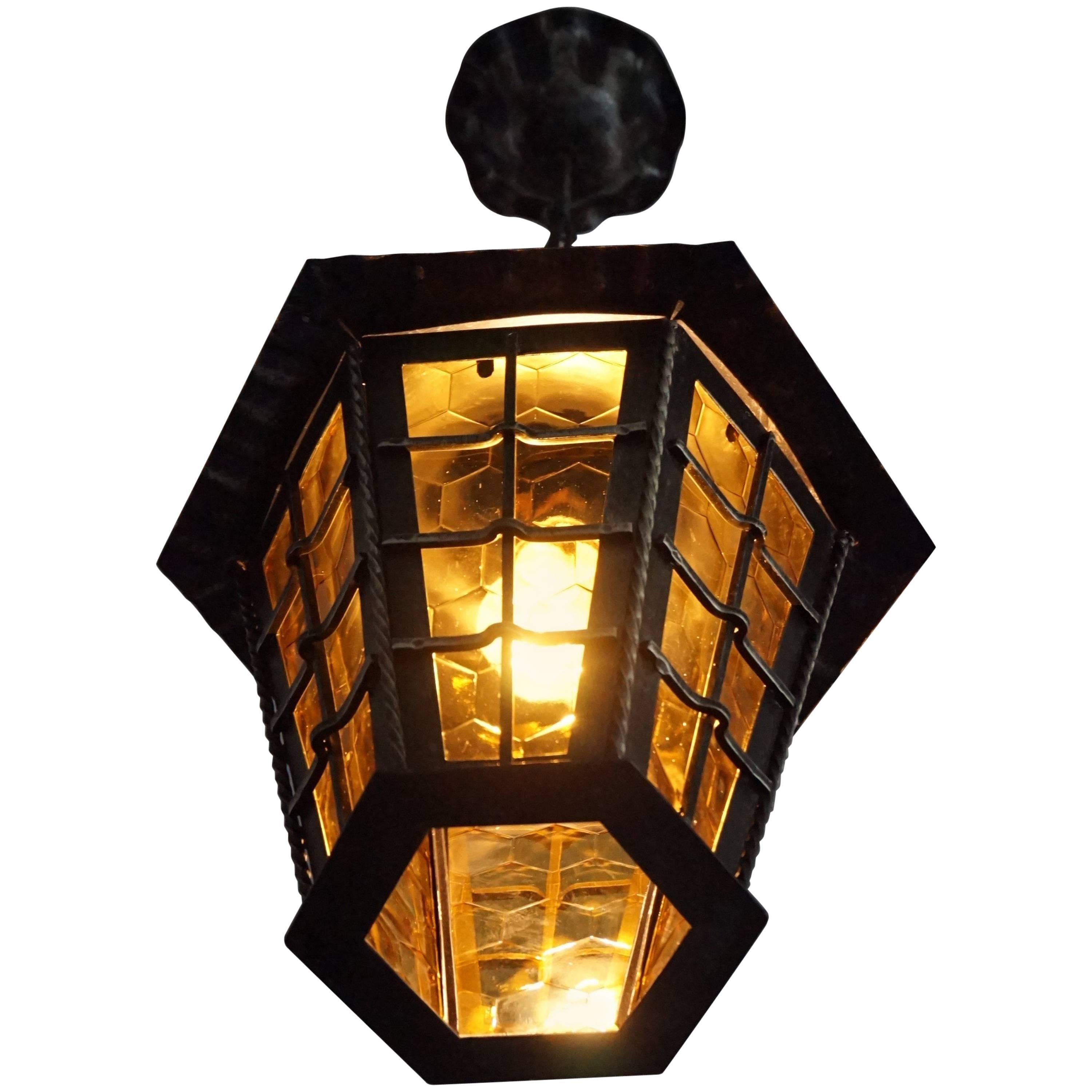 Arts & Crafts Style Wrought Iron Pendant with Honeycomb Color and Pattern Glass For Sale