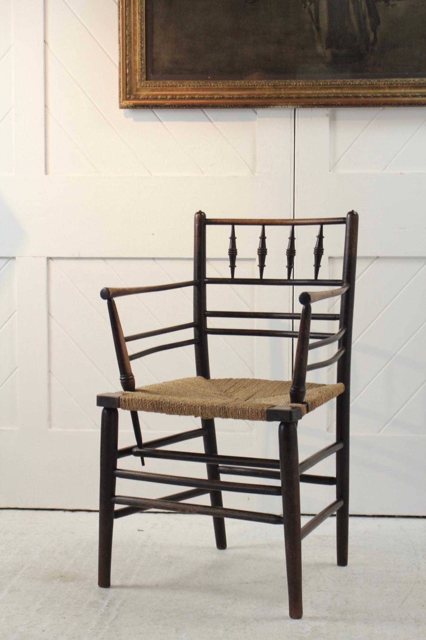 Arts & Crafts ‘Sussex’ chair
Made using ash and beech woods 
Ebonised 
with seagrass seat
This chair was designed by Philip Webb for Morris & Co
Circa 1880.