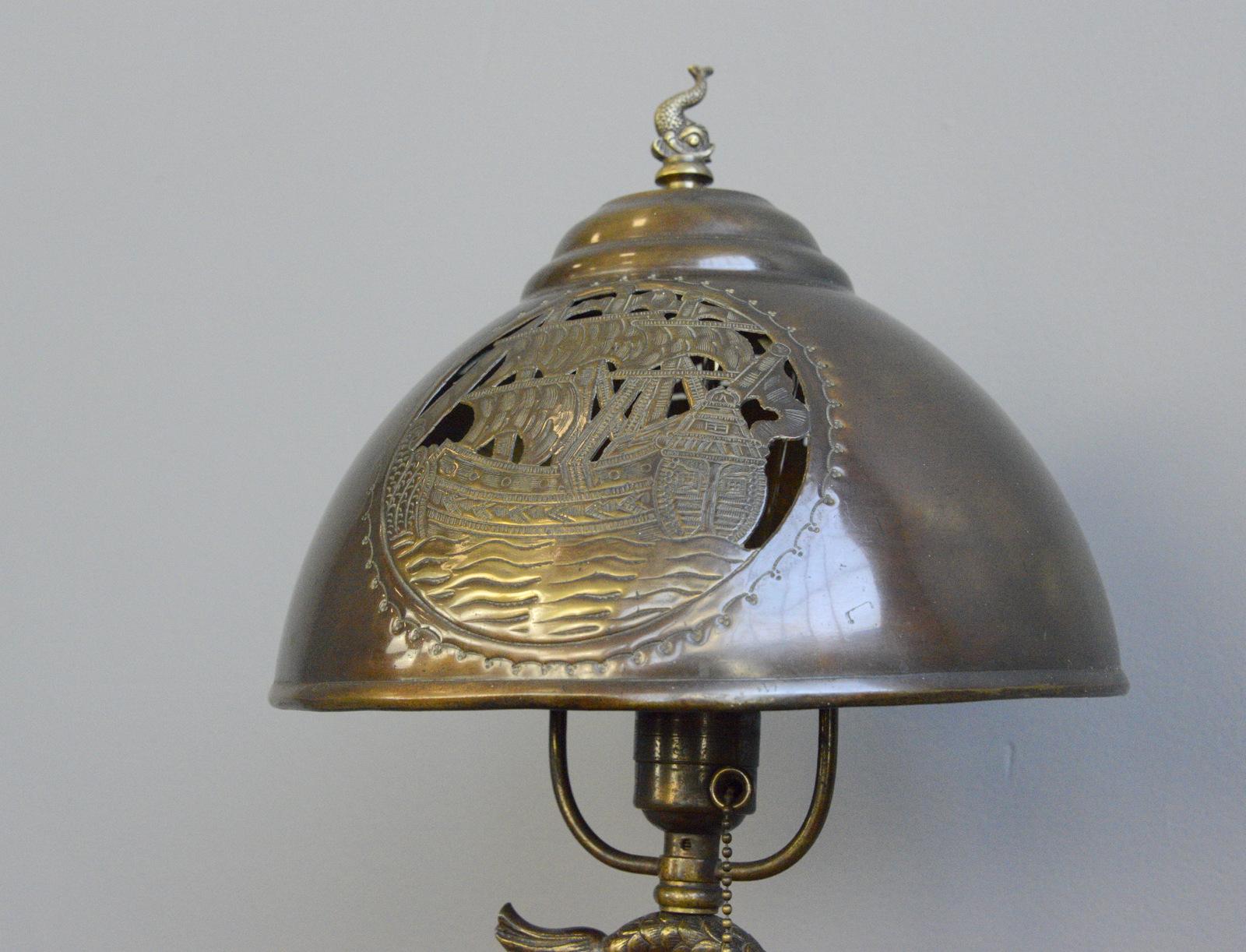 Arts & Crafts table lamp, circa 1890

- Engraved copper shade
- Solid brass fish shade topper
- Takes B22 fitting bulbs
- Original pull cord switch
- In the manner of The Birmingham Guild of Handicraft
- English, 1890
- Measures: 50cm tall x