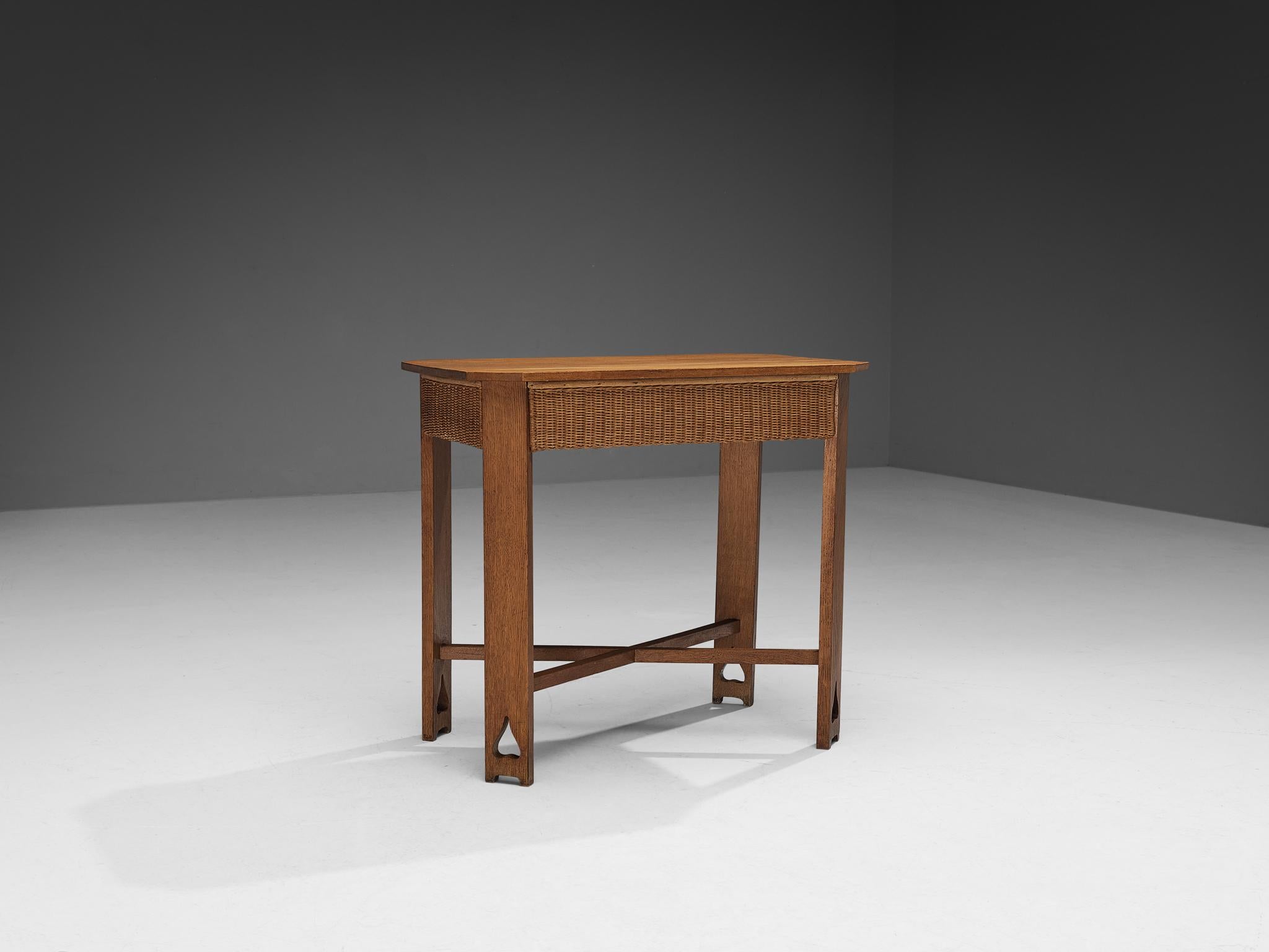Table, oak, cane, Austria, 1920s

This eloquent table or small desk is designed during the Arts & Crafts period in Germany/Austria approximately around the twenties and designed by an experienced craftsmen whose identity is unfortunately not yet