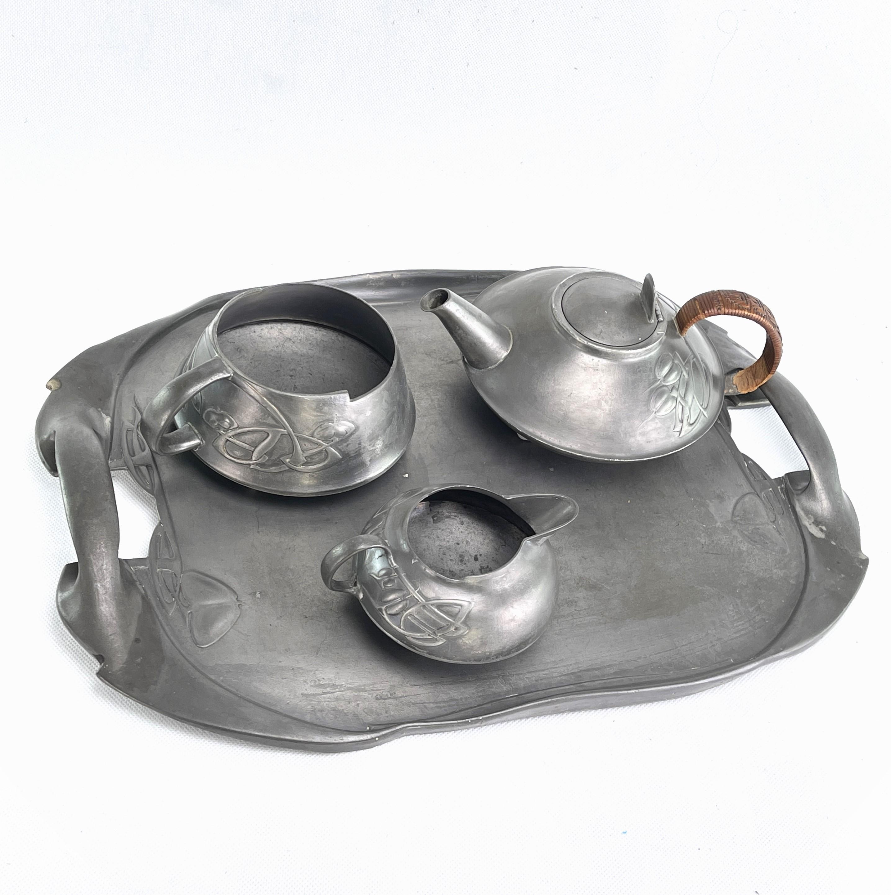 Tea Service by ARCHIBALD KNOX Liberty & Co. Tudric pewter, 1905

Four piece Arts & Crafts Tudric pewter tea service designed by Archibald Knox for Liberty & Co. Everything is offered in a cleaned, unpolished condition.

Set number 0231, the service