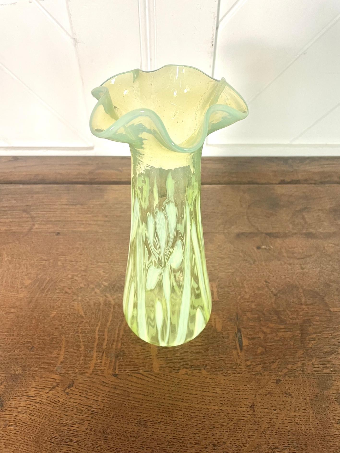 Arts & Crafts large vaseline glass vase with opaline iris pattern

Fluted top and flared base

John Walsh Walsh

Circa 1900

Height 26cm. Diameter 11cm.

John Walsh Walsh

John Walsh Walsh was a successful businessman and in 1850 he purchased an
