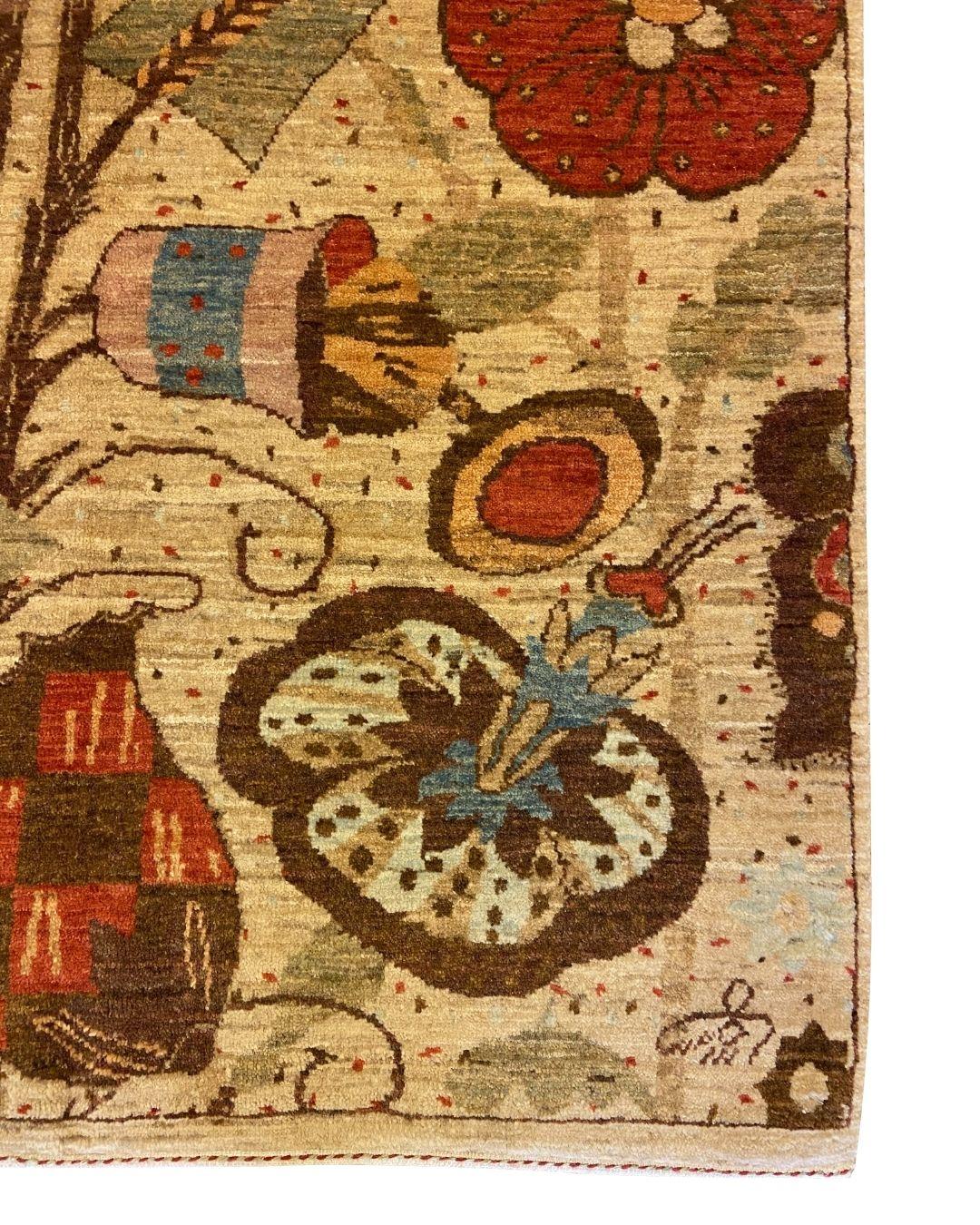 This handknotted Arts & Crafts wool rug, featuring a stunning pattern of stylized flowers and butterflies in rich hues of red, brown, and green, brings nature-inspired elegance to any room. The intricate floral designs and fluttering butterflies are