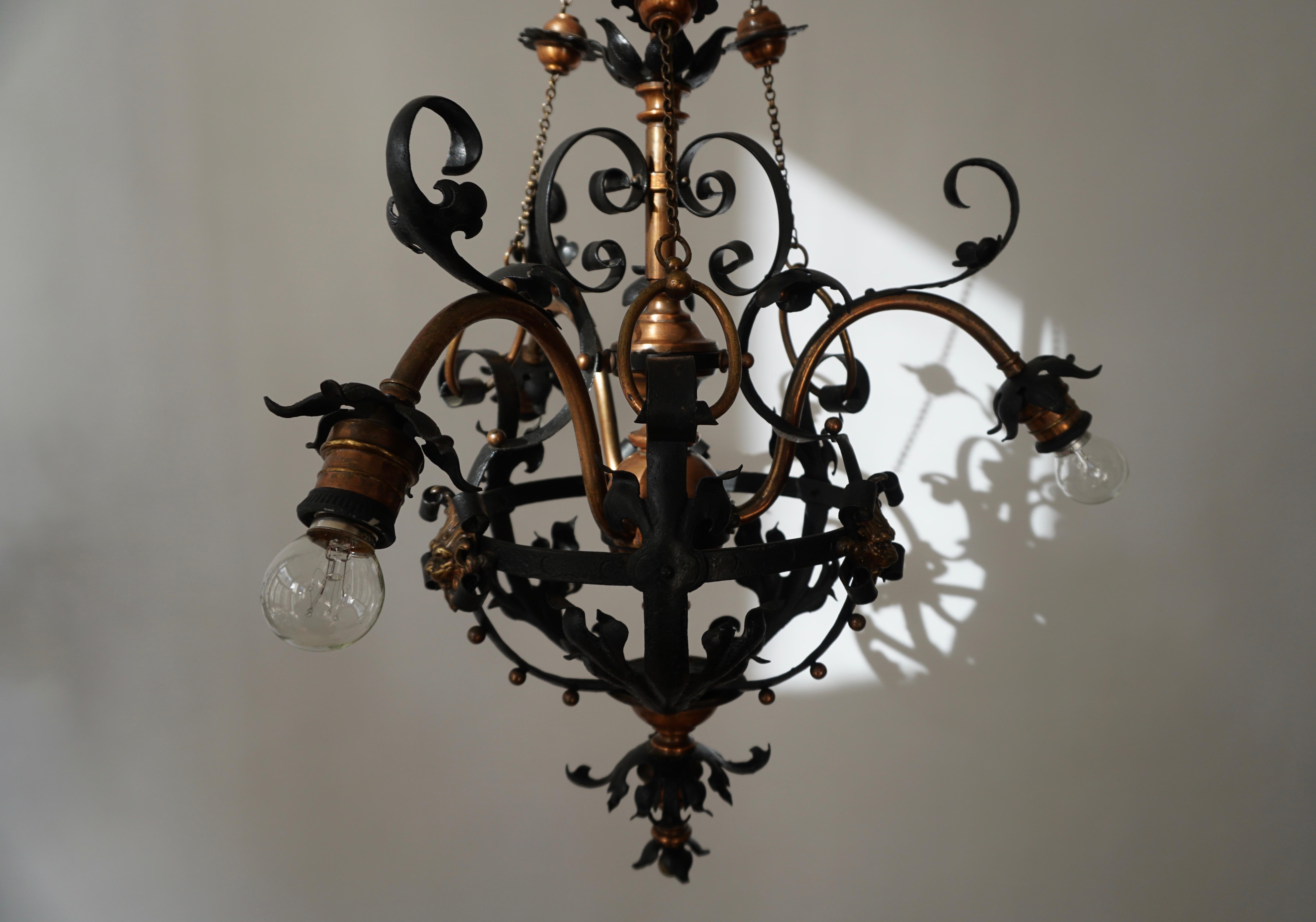 Belgian Arts & Crafts Wrought Iron and Copper Castle Chandelier with Bronze Lion Heads For Sale