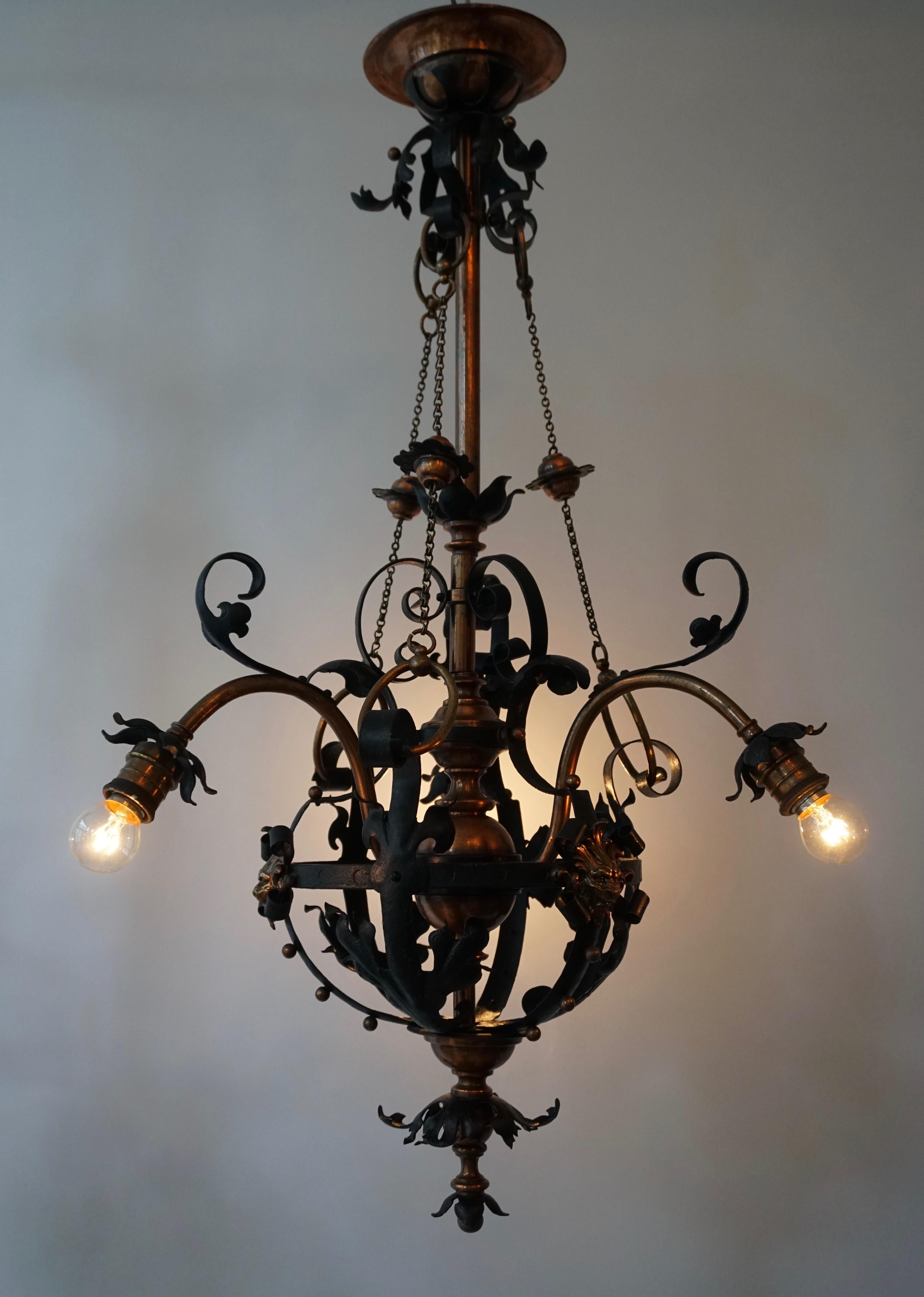 20th Century Arts & Crafts Wrought Iron and Copper Castle Chandelier with Bronze Lion Heads For Sale