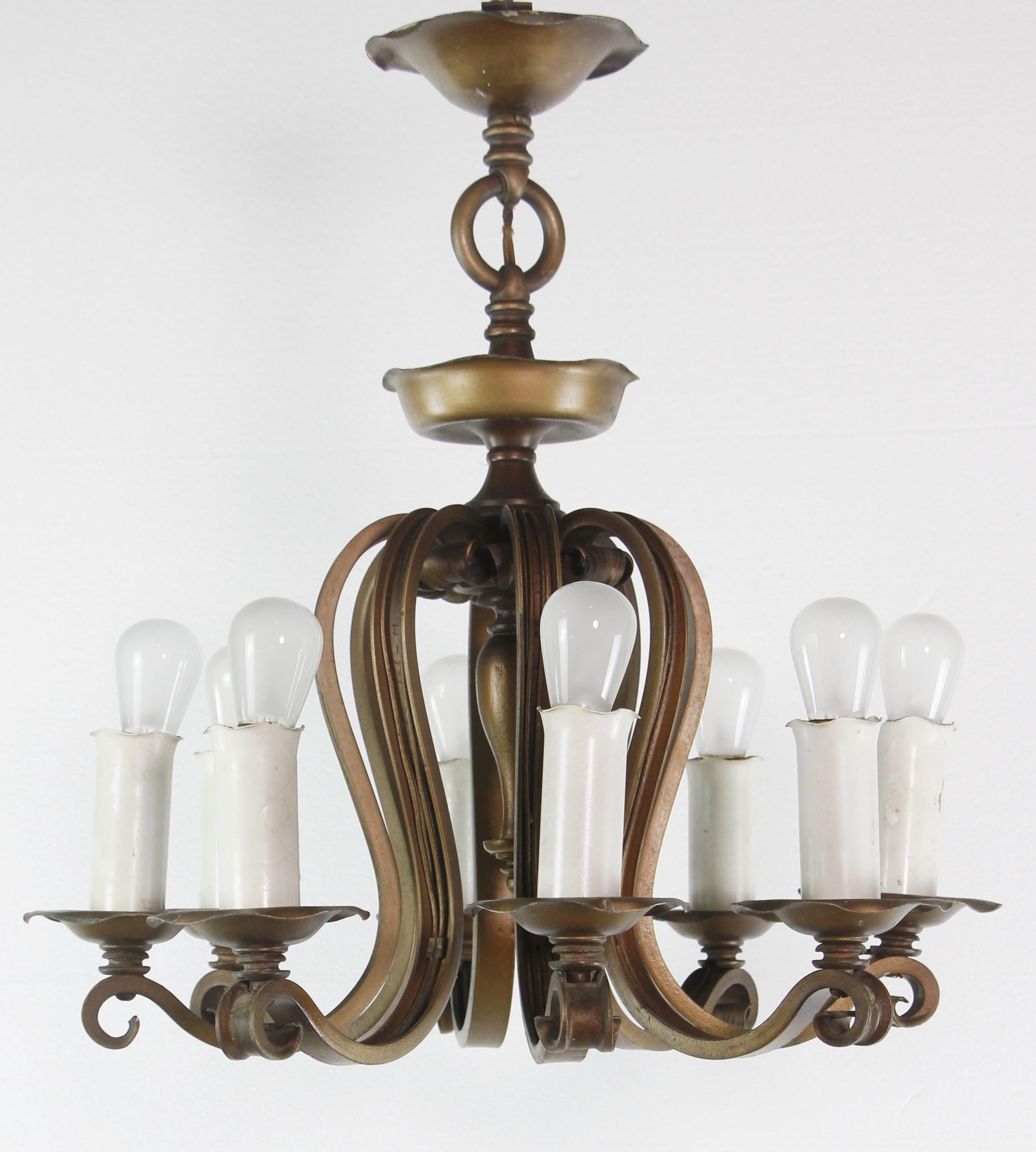 Antique hand hammered bronze and iron eight light chandelier. Cleaned and restored. Takes eight medium base light bulbs. Please note, this item is located in our Scranton, PA location.
