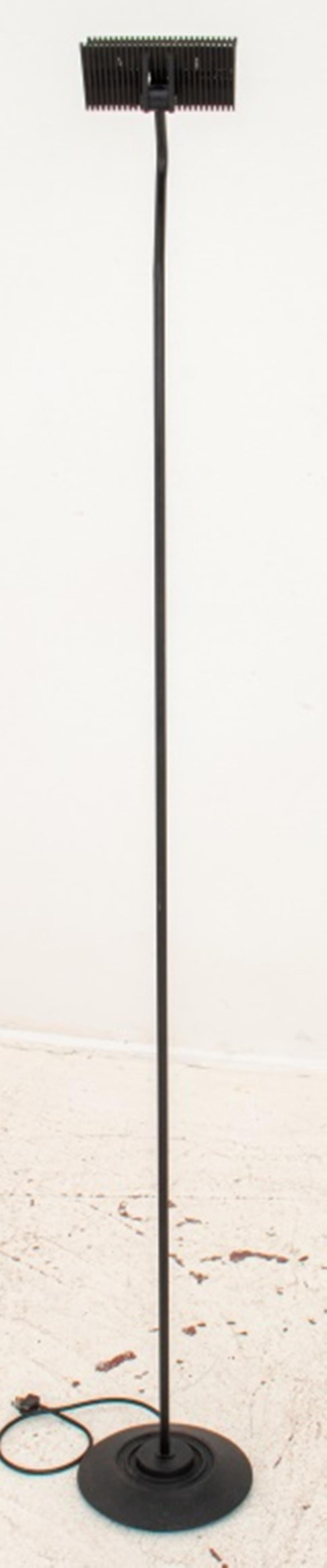 Artup Post-Modern black lacquered metal halogen adjustable floor lamp raised on a circular base, marked 