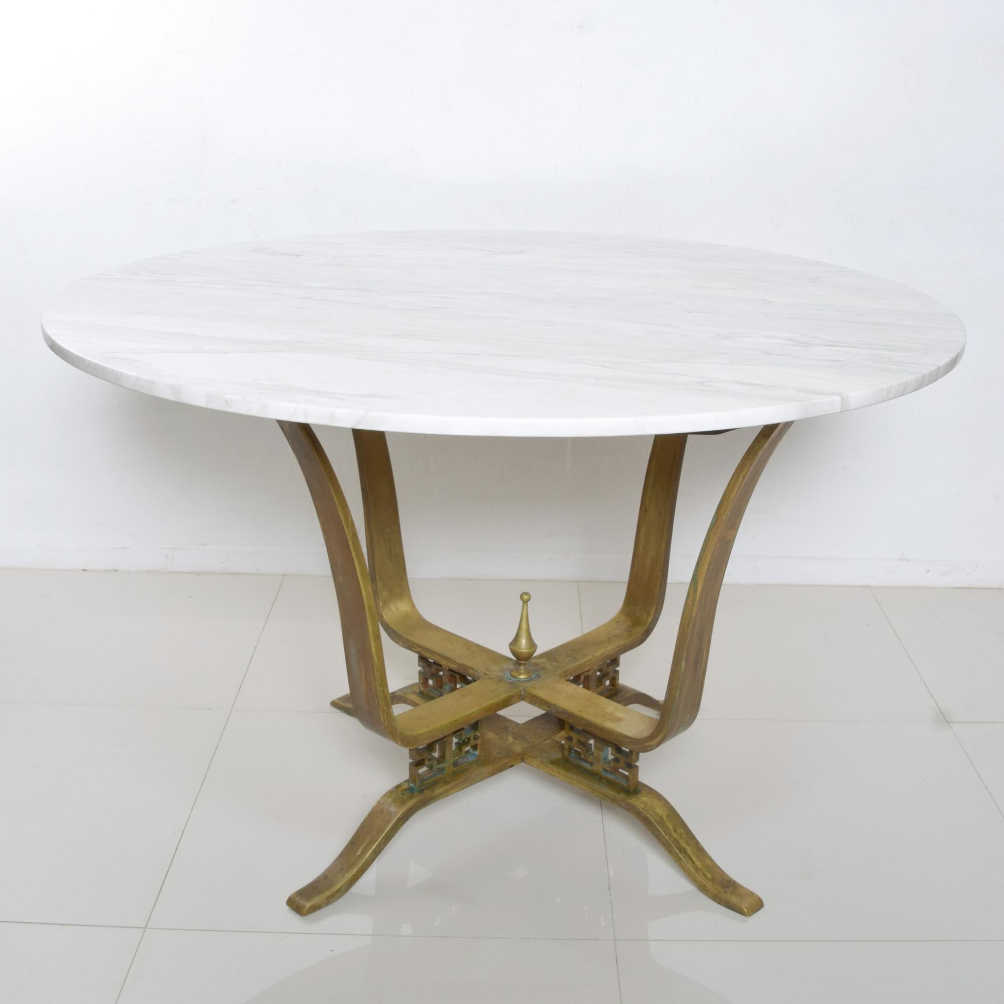 Arturo Pani Dining Table in Crisp White Marble on an intricately designed Bronze base featuring geometric modernist lines, Modernism Mexico 1950s
Stunningly elegant.
Dimensions: 29 1/2