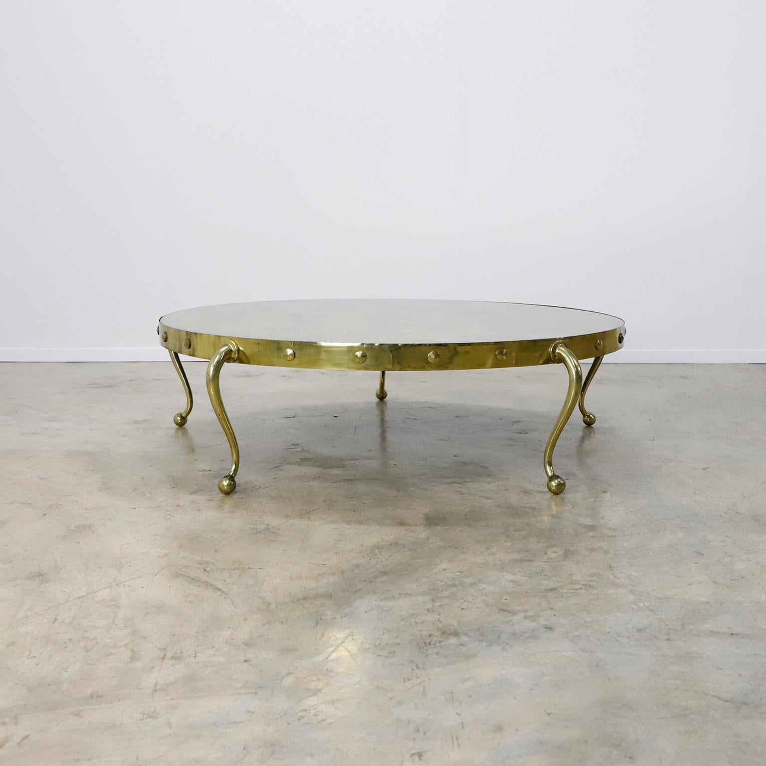 Circa 1960. We offer this cocktail table designed by Arturo Pani, the table are made in solid bronze whit spectacular legs design.