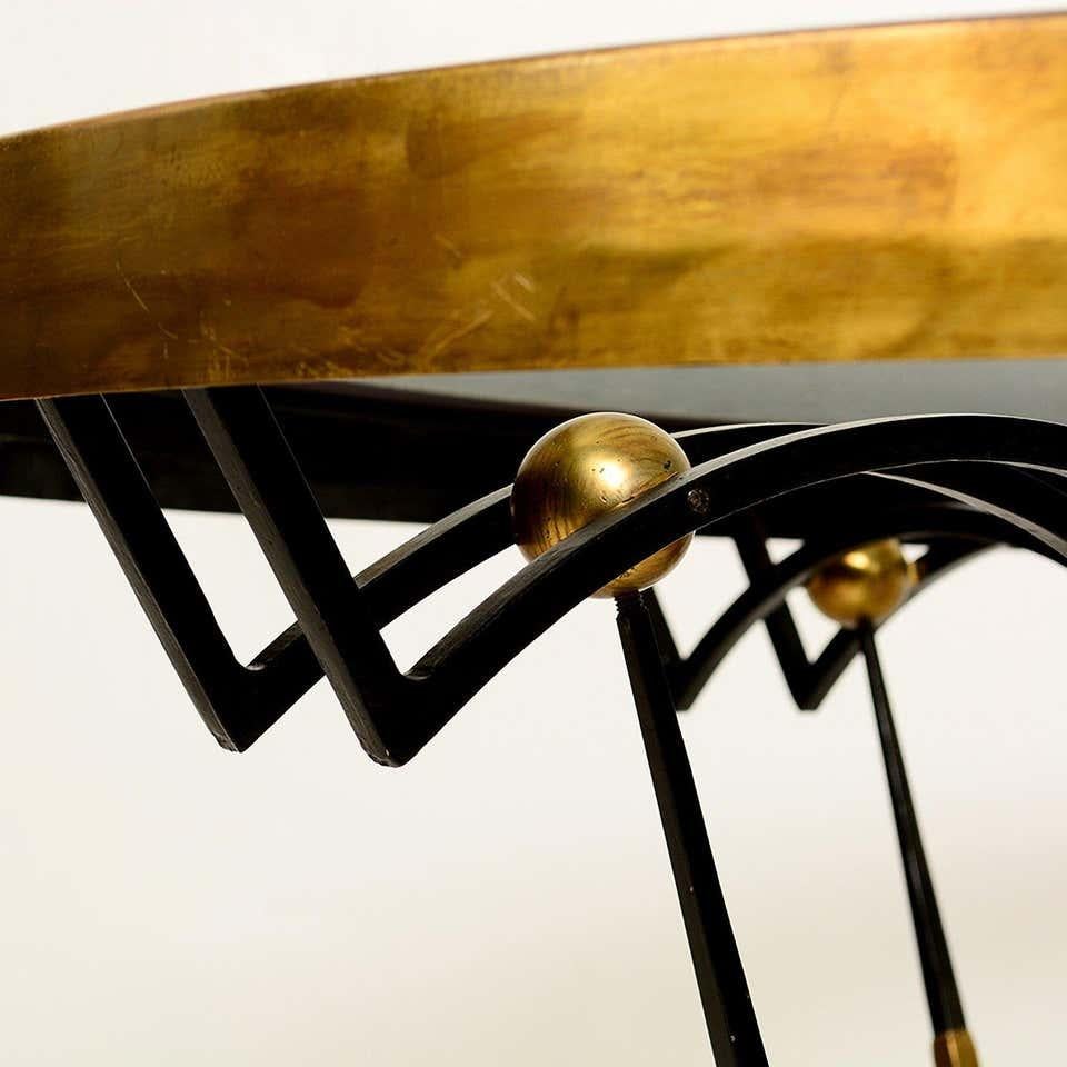 Midcentury elegance Arturo Pani Regency round dining table of gilded brass on sculpted black iron topped with antique art glass and malachite center sculpture done by Pepe Mendoza- simply divine, Mexico, 1950s.
Measures: 55.5