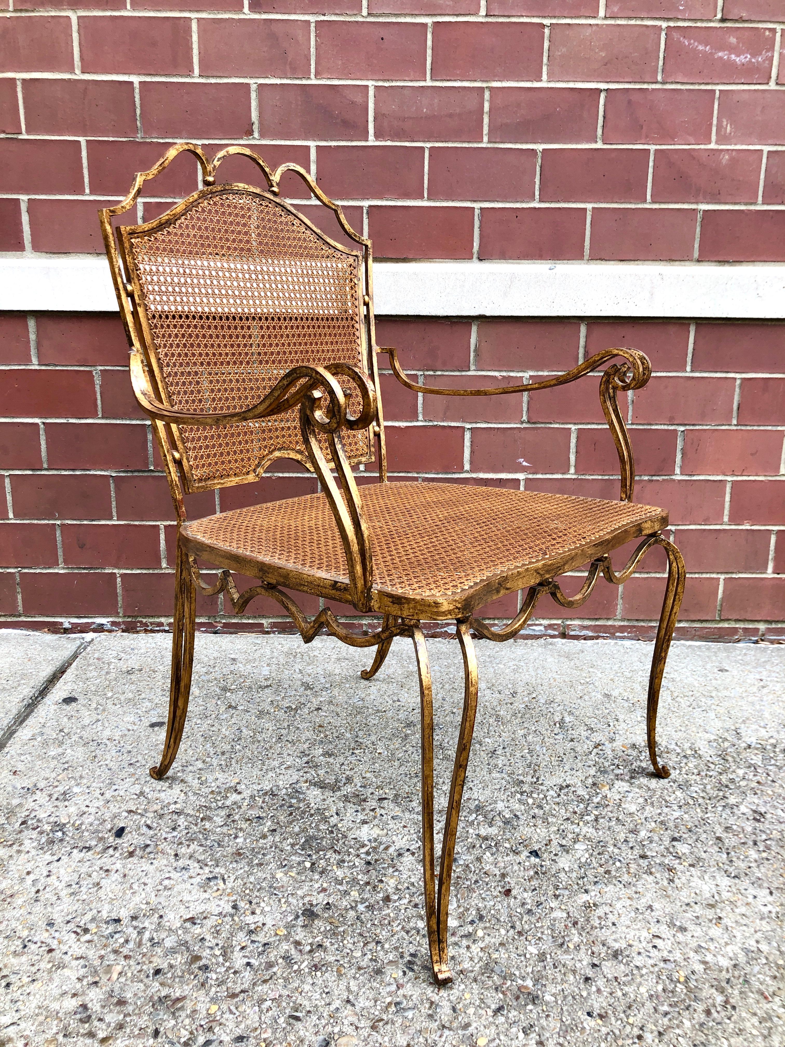 Late 1940s, Mexico, with fancifully scrolling metalwork and hand caned seat and back. An elegant and versatile design.