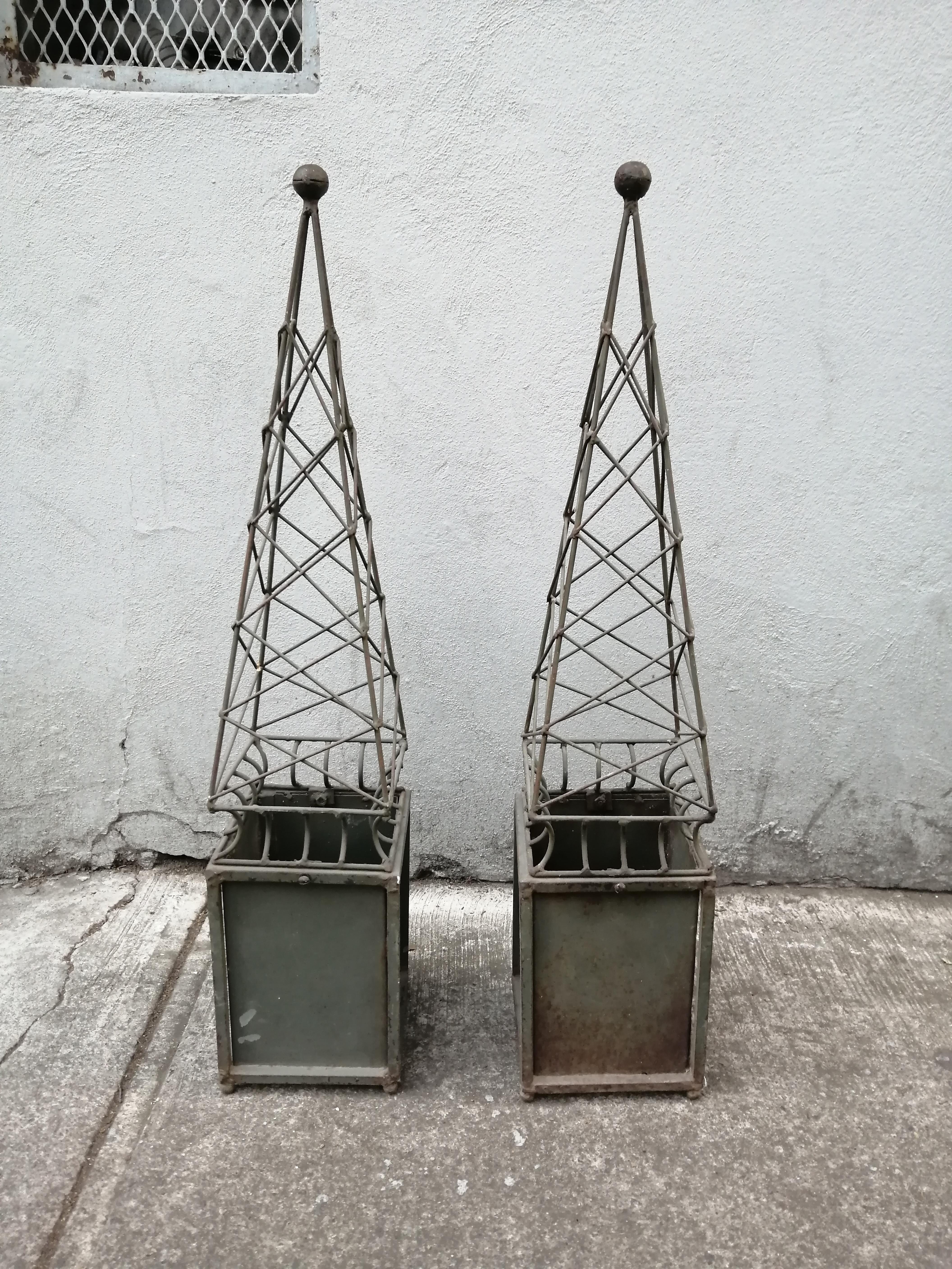 Pair of Mexican Mid-Century Modern iron obelisks. The obelisks show green patina.