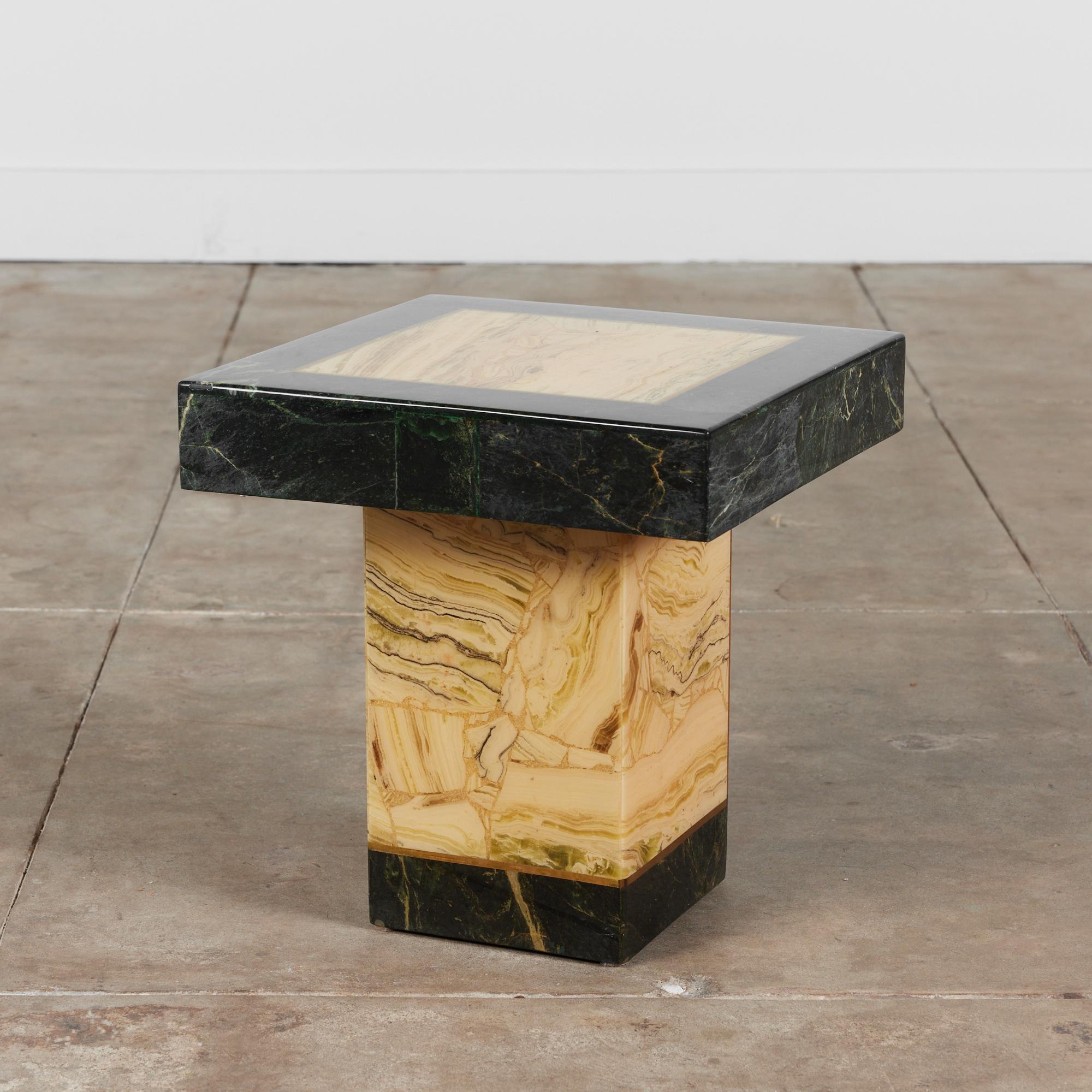 Onyx pedestal side table by Arturo Pani for Muller of Mexico, circa 1970s. The side table features a beige toned onyx with darker brown veining. The table is rimmed with a thin gold enamel inlay with a thicker dark green onyx edge on the table top