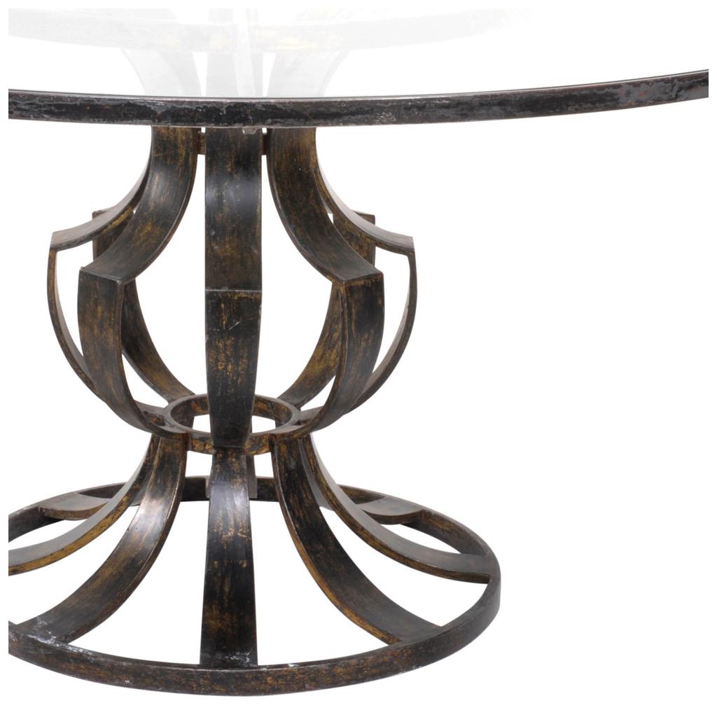 Stunning patinated steel dining table by Mexican designer Arturo Pani. Round clear glass top with balauster-shaped base.

Arturo Pani was a Mexican furniture designer. He studied in the École des Beaux Arts in Paris along his brother, Modernist