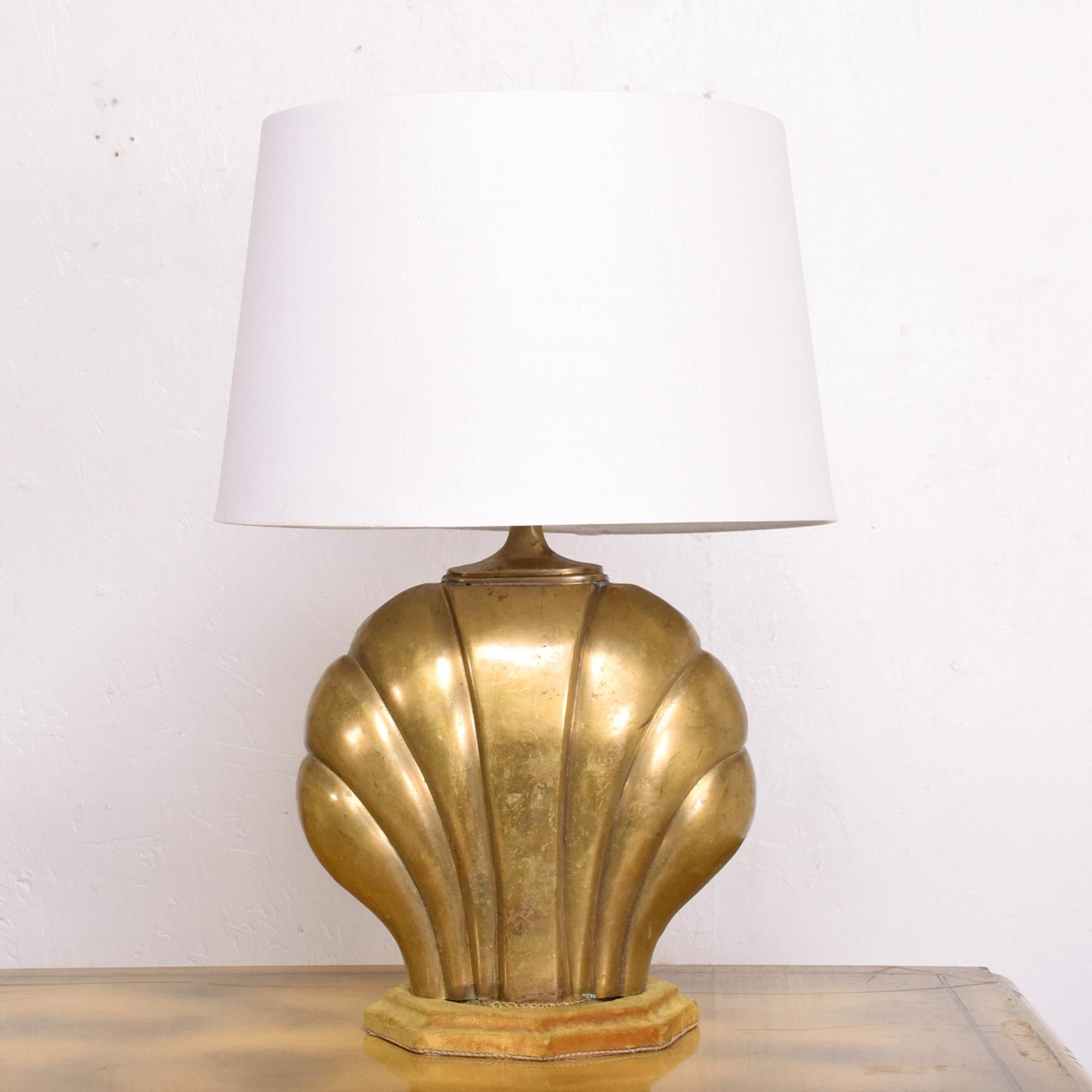 Table Lamp
Mexico 1940s by Arturo Pani Seashell Table Lamp Cast in Brass mounted on original velvet covered wood base 
Velvet base is in a golden yellow tone. No shade is included.
Rewired and ready to go. 
16 tall (base of the socket) x 12 W x 8.5D