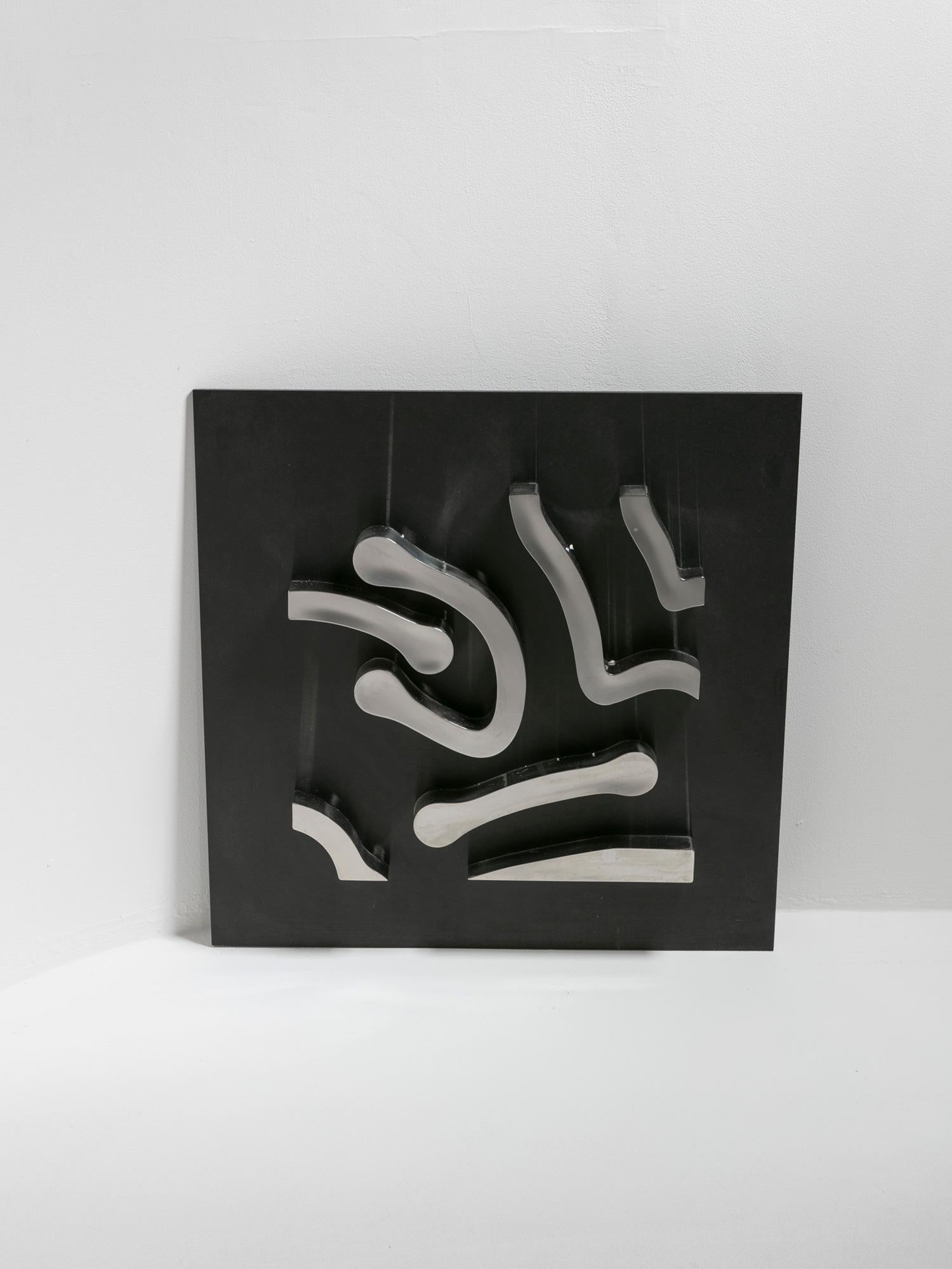 Steel artwork by Duccio Berti.
Abstract wall sculpture composed by stainless steel elements creating labyrinthine paths.
Signed and dated on verso.