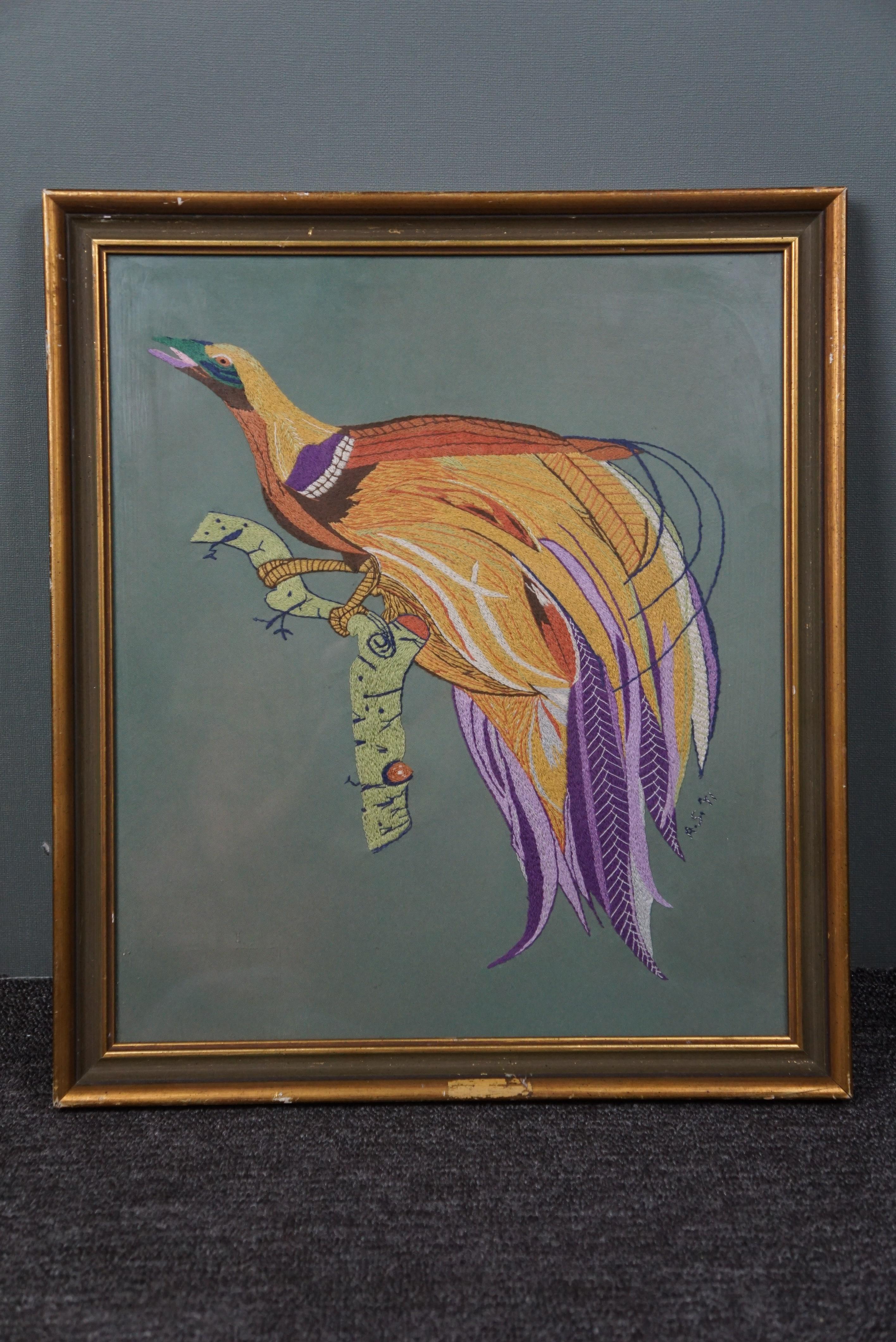 Offered is this embroidered image of a colorful bird.
This beautiful handmade image of a bird of paradise is fully embroidered. If you look at the artwork up close you will see every detail of the yarn made with the so-called 'New England stitch'. A