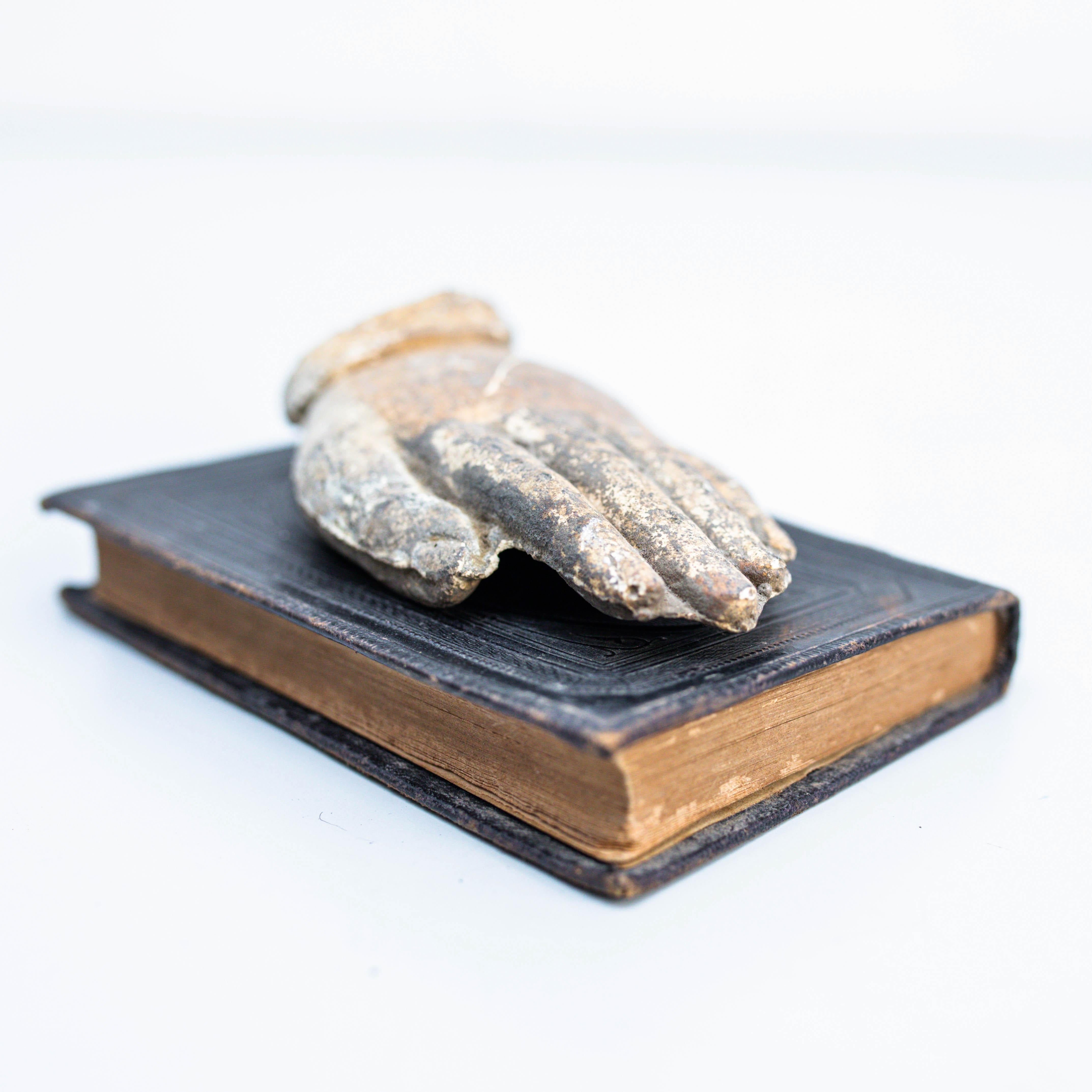 Artwork With Old Book and Mysterious Sculpture Hand.    Made by unknown manufacturer in Spain, circa 1990.    In original condition, with minor wear consistent with age and use, preserving a beautiful patina.     Materials:  Wood.  Chalk.   