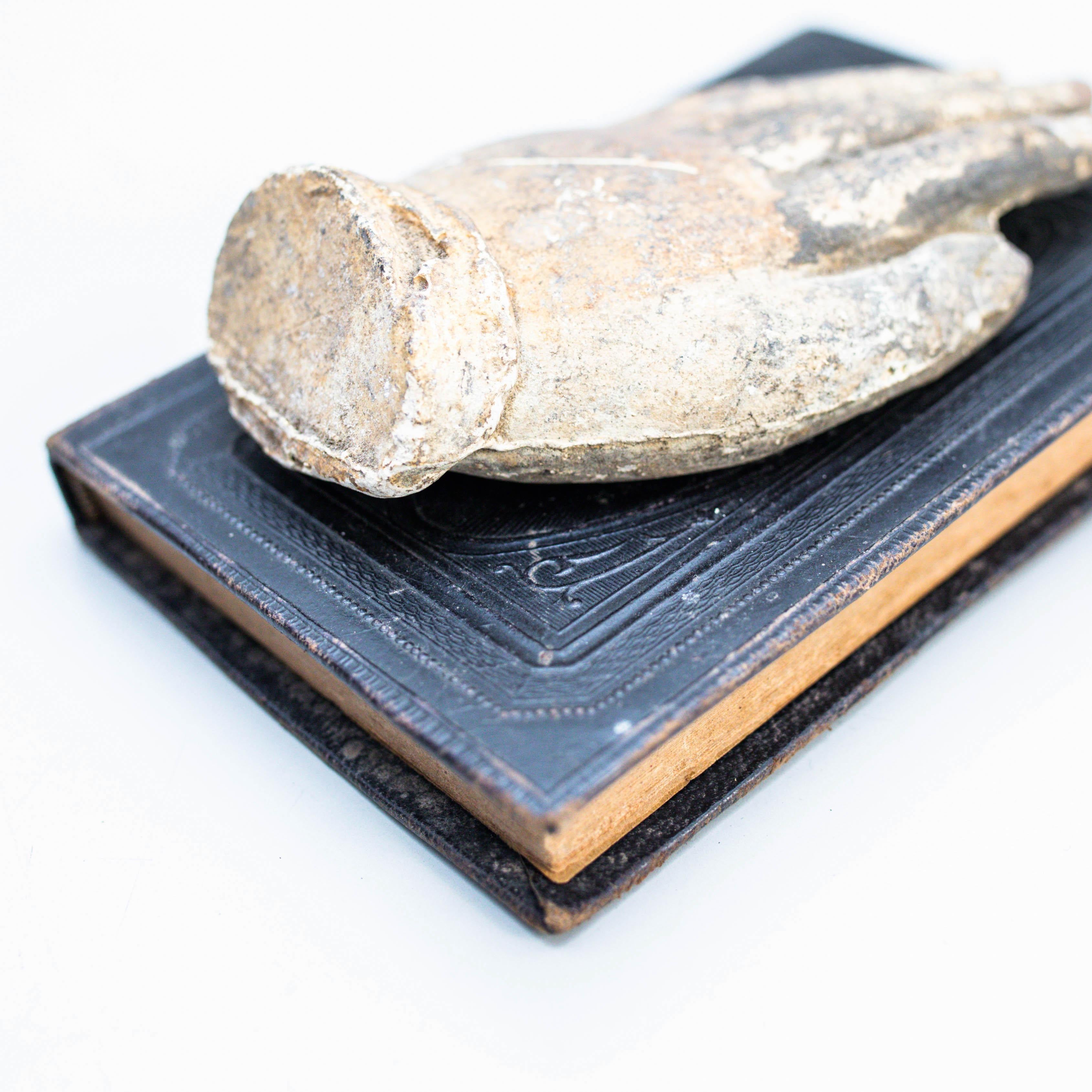 Spanish Artwork with Old Book and Mysterious Sculpture Hand, circa 1990 For Sale