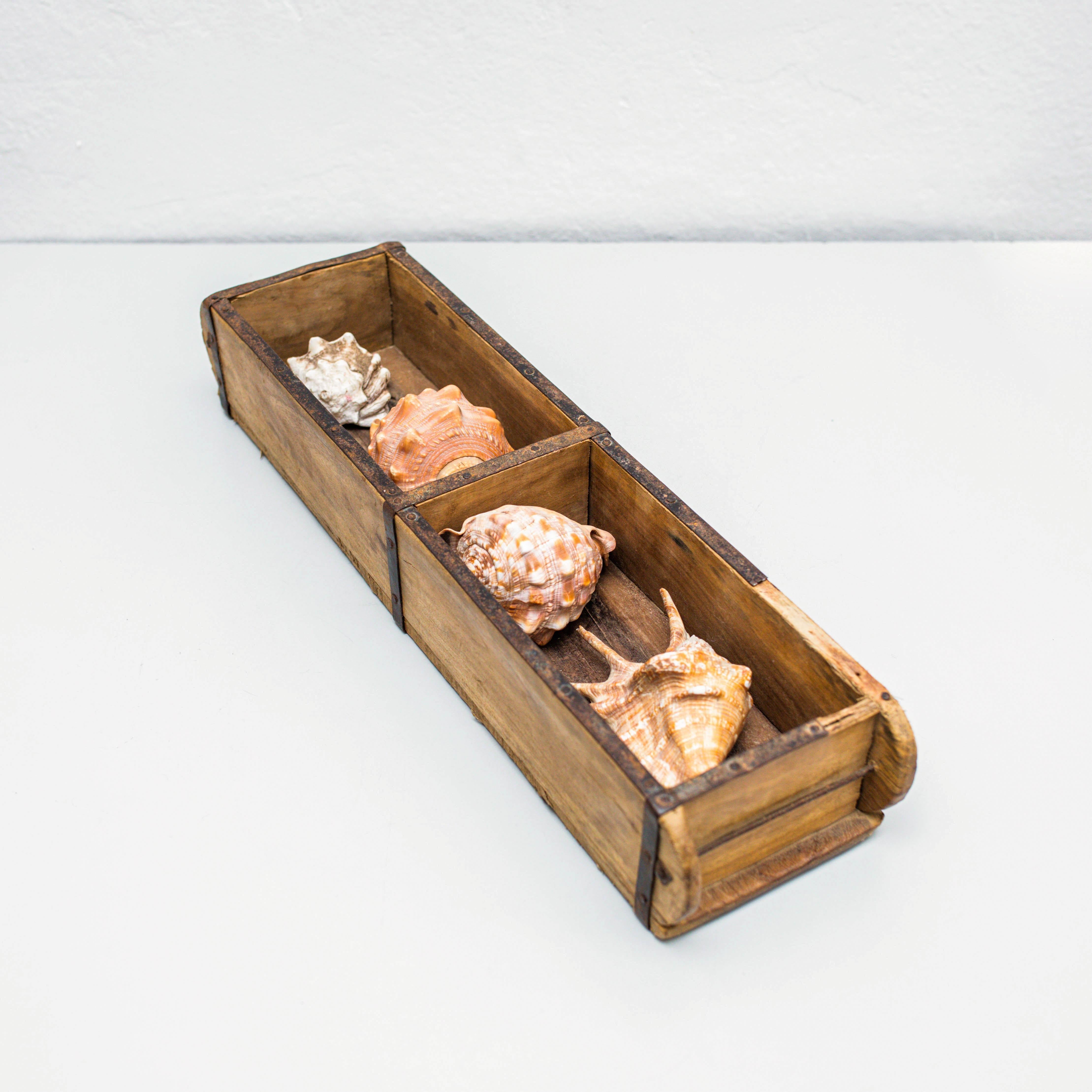 Artwork with shells.    Made by unknown manufacturer in Spain, circa 1990.    In original condition, with minor wear consistent with age and use, preserving a beautiful patina.     Materials:  Wood.  Shells.    Measures:  H 9cm  W 60cm  D 15cm   