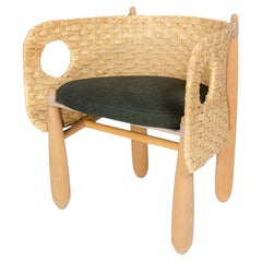 Sillón Aruanã de interior de madera maciza, ratán natural Técnicas sostenibles.