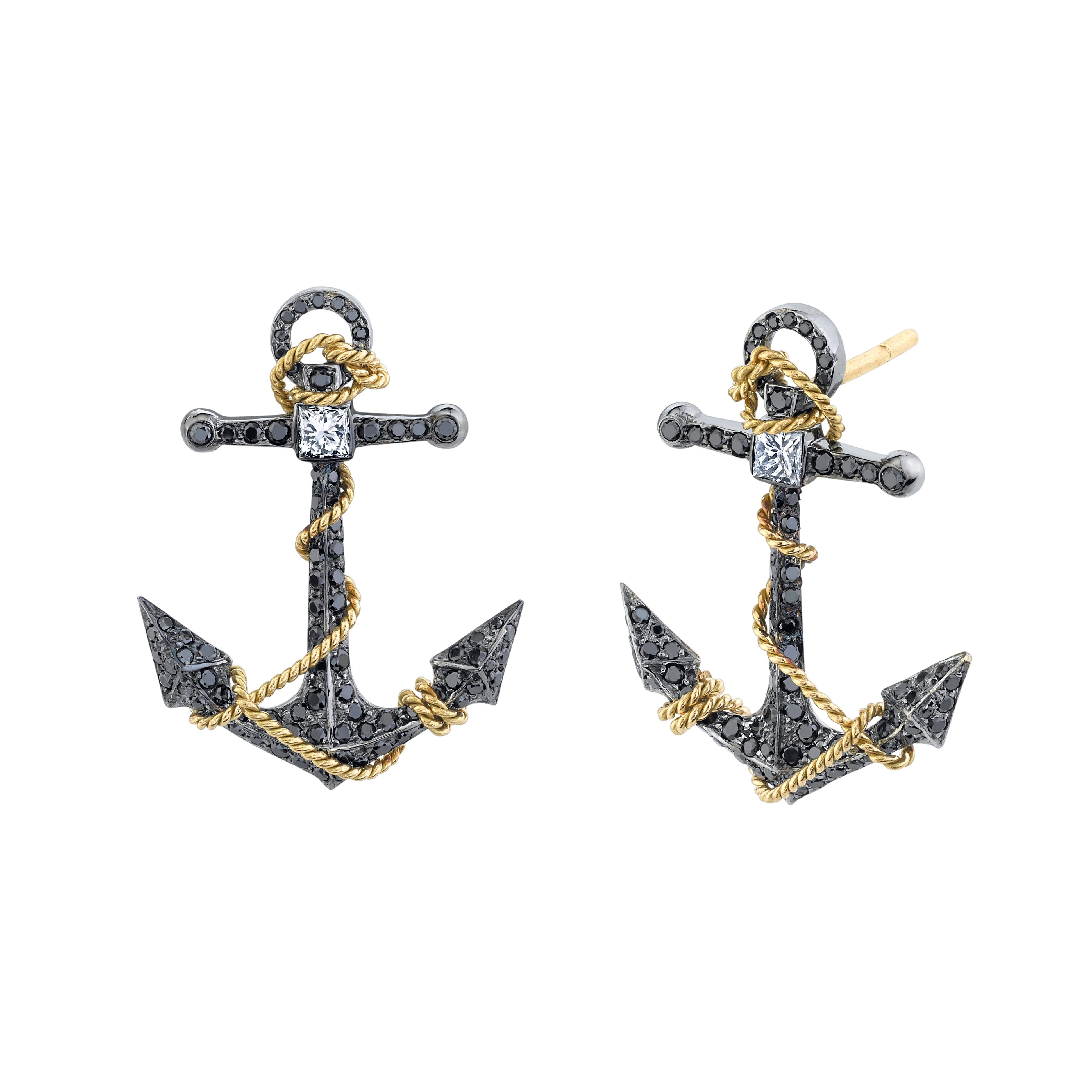 Beautiful and unique black diamond anchor earrings featuring 0.23 carats of white diamonds and 0.75 carats of black diamonds set in 18 karat gold. These earrings contain both 18 karat yellow gold and 18 karat blackened gold, creating an elaborate