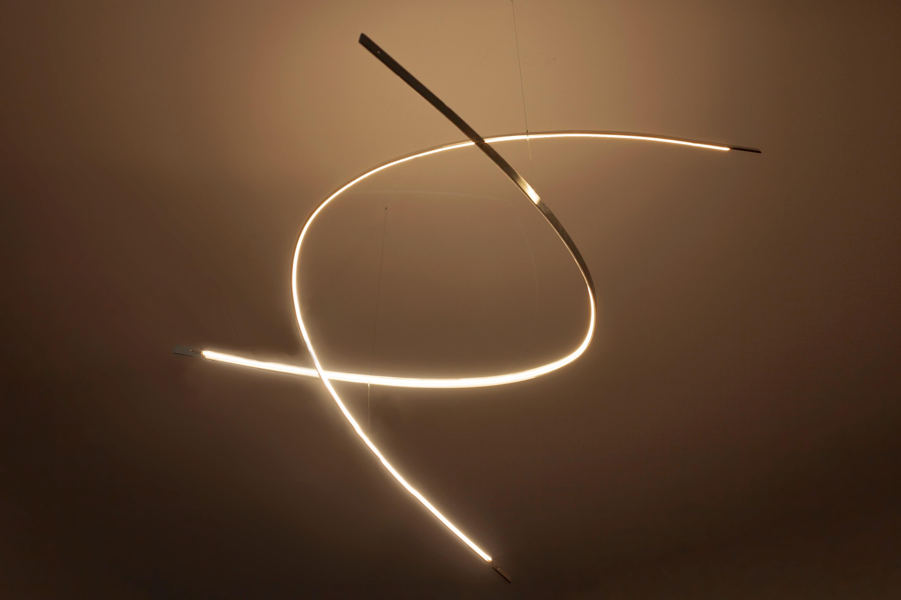 Modern Arx - a minimal, sculptural chandelier that emits rich, calm candle-like light For Sale