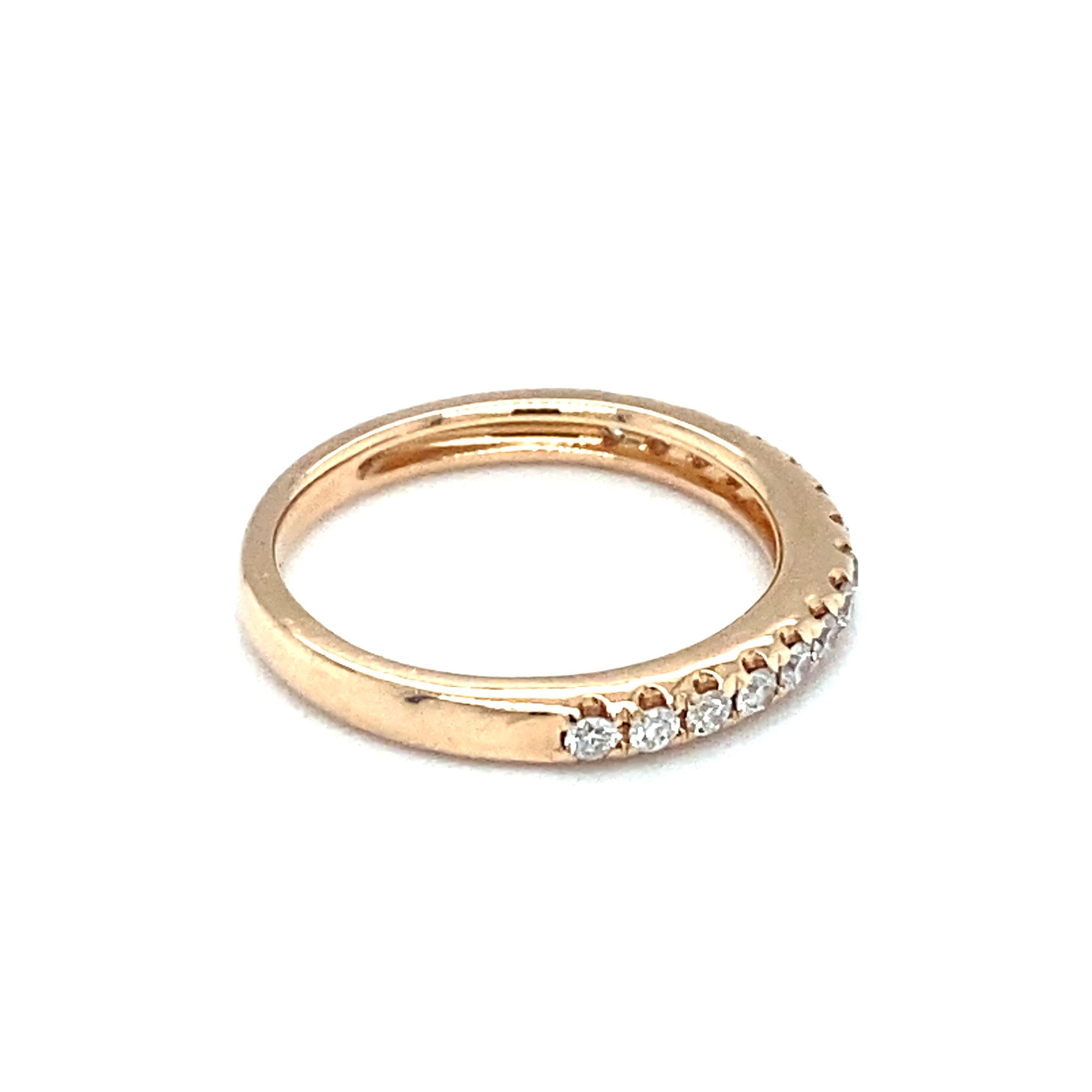 Item Details: This ring is crafted of 14 karat rose gold with diamonds halfway around the band. Stamped ARYA. 

Circa: 2000s
Metal Type: 14 Karat Rose Gold
Weight: 2.0 grams
Size: US 4, slightly resizable

Diamond Details:

Carat: 0.28 carat total