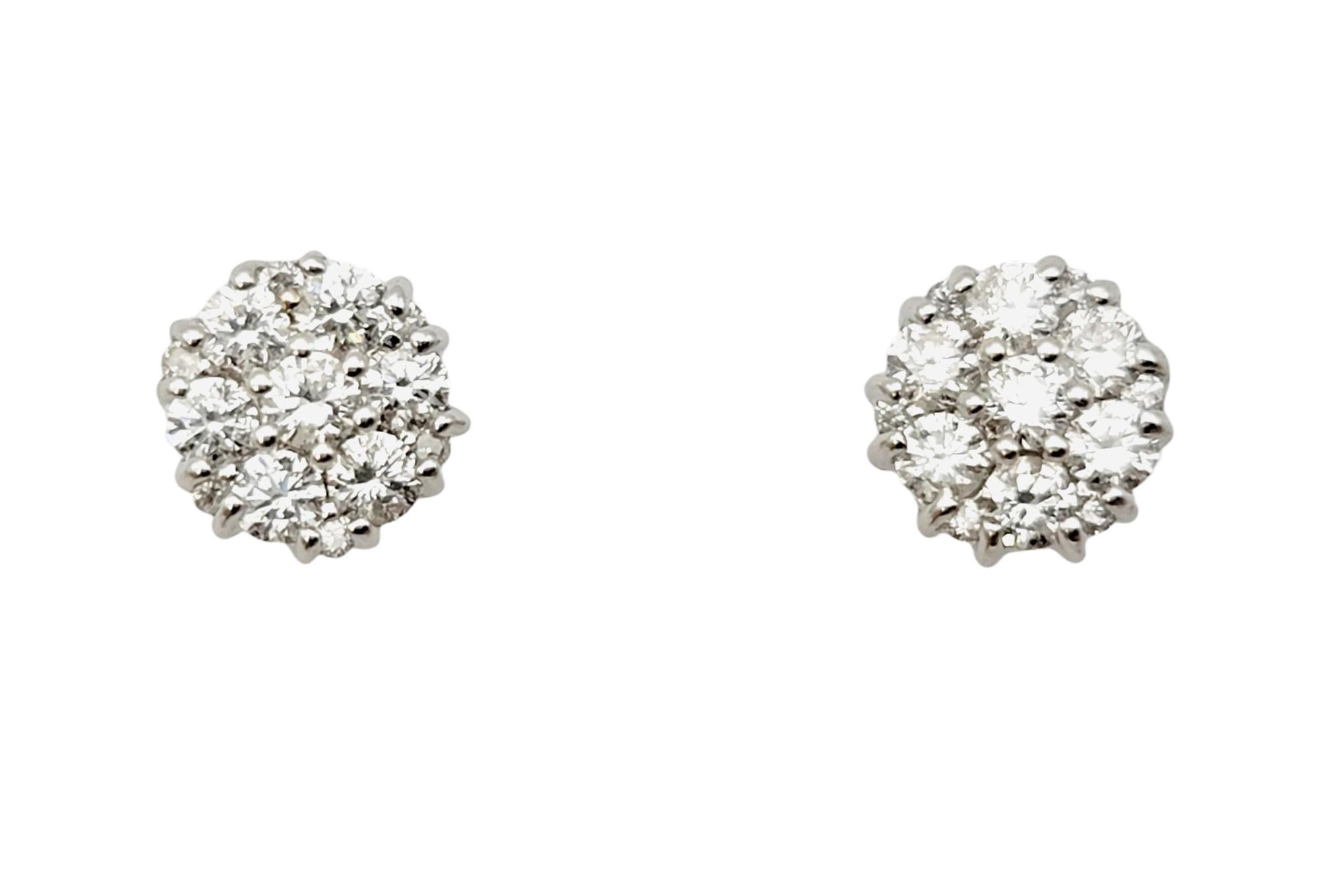 Glittering diamond stud earrings with a feminine twist. The sparkling natural stones are set in polished white gold and arranged in a flower motif, allowing the closely set prong set diamonds to sparkle from every angle.

Earring type: Stud
Metal: