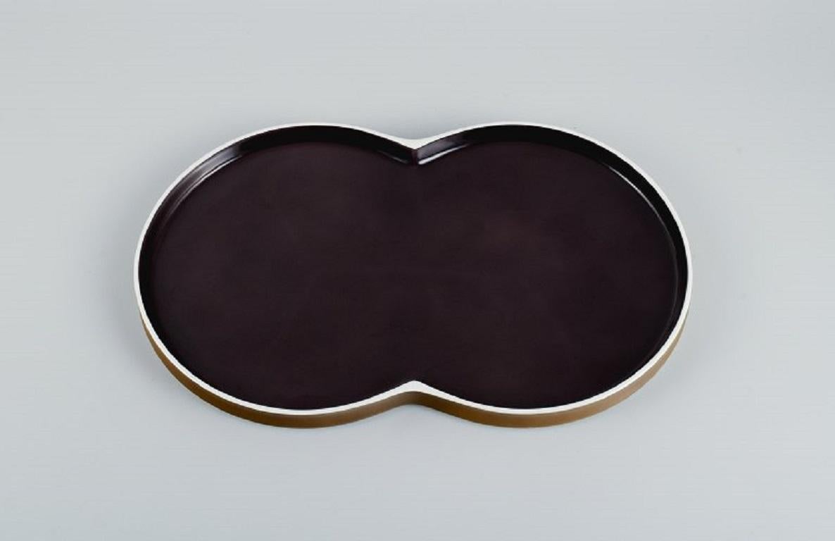 Arzberg, Chromatics, Germany. Large modernist porcelain tray in golden brown and black.
Late 20th century.
Measurements: L 38.0 x W 23.5 x H 2.5
In perfect condition.
Marked.