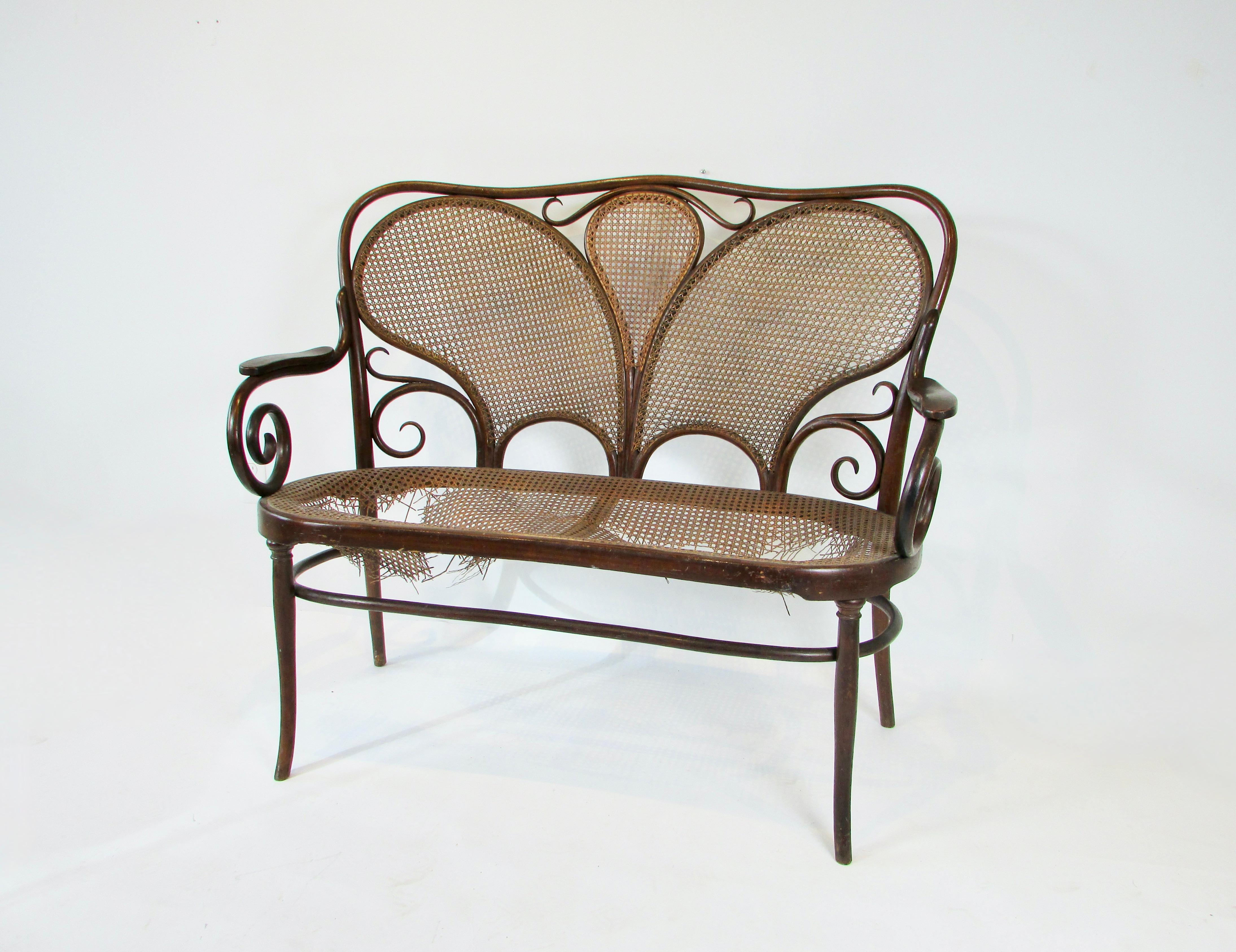 Estate find elaborately bent wood settee with caned back rest and seat . Seat caning needs to be restored . I do not have access to a competent craftsperson . I am listing the chair as is . Hoping someone has a caner . Stamped Jacob and Josef Kohn