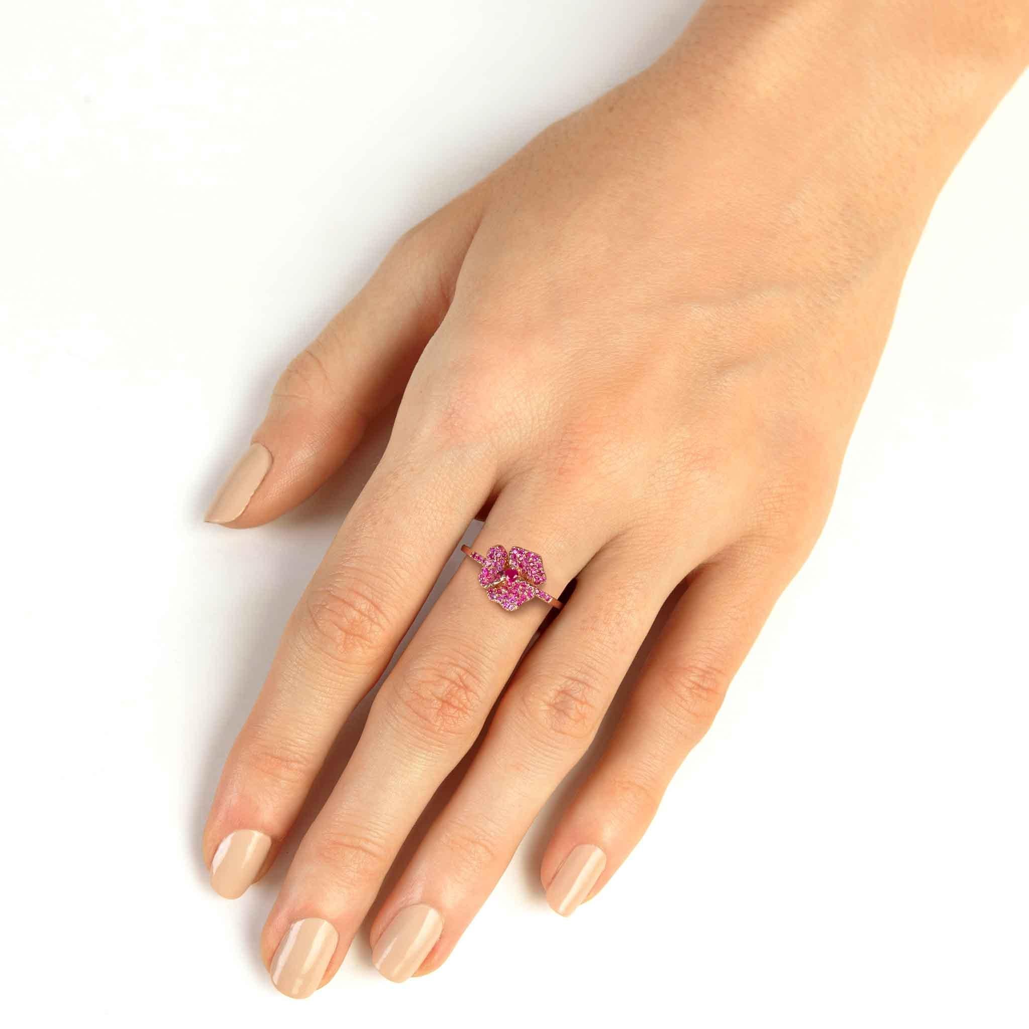 Crafted in 18K pink gold, this elegant ring encrusted with Pink Sapphires.

Part of our bloom collection, this pansy flower-inspired piece was designed to remind you of the infinite possibilities within. 

18K Pink Gold
Pink Sapphires Carat Weight: