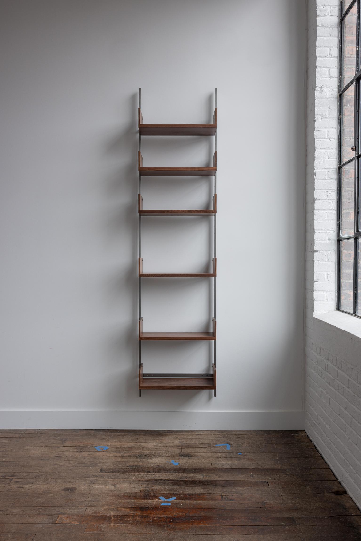 The AS4 modular shelving unit is handmade using solid hardwood with dovetail joinery, and solid steel.  This single-bay shelving unit can easily be rearranged, expanded upon, and relocated - adapting to your needs as they change (unlike traditional